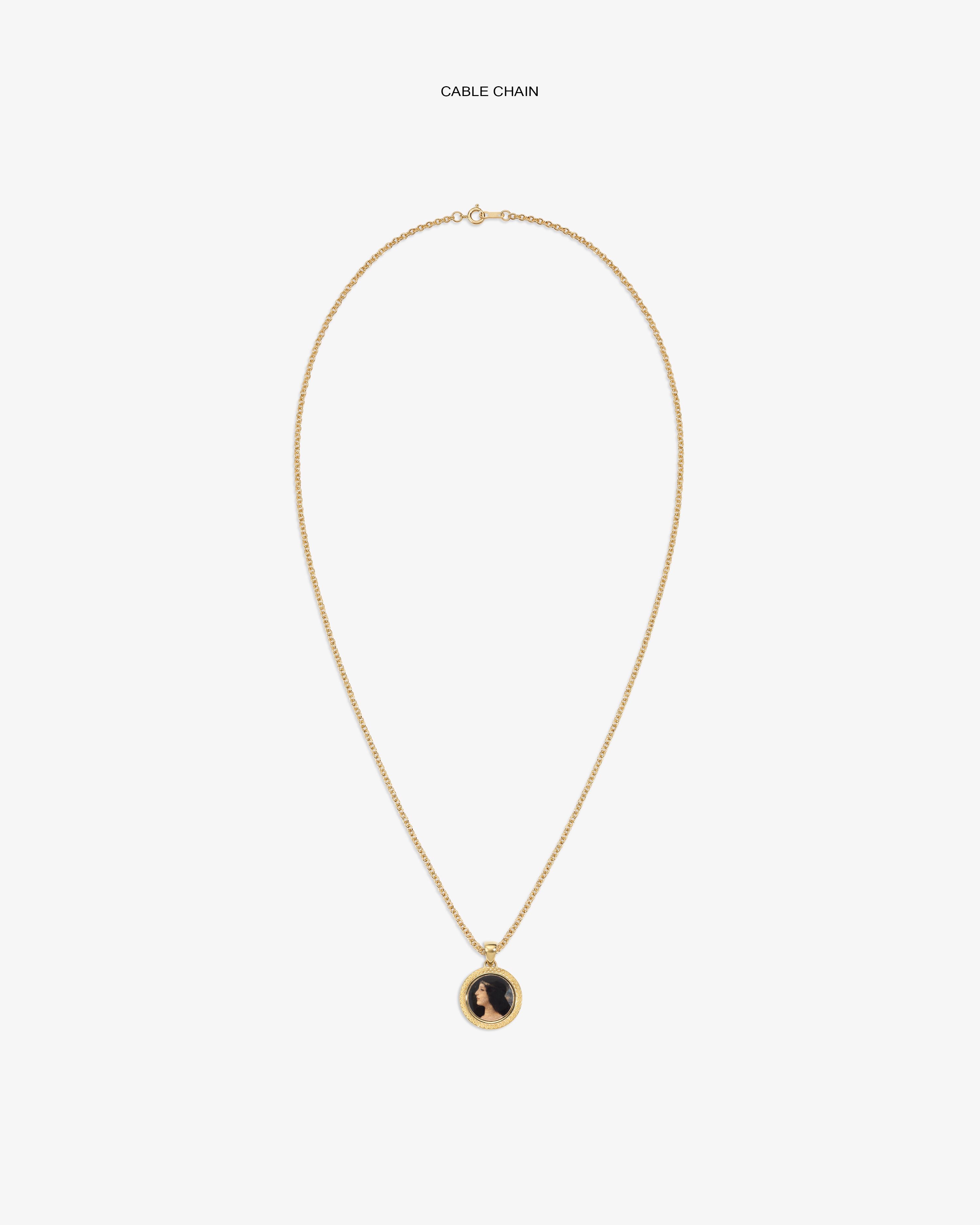 14Kt Gold Hera Pendant: Gold cable chain necklace with round pendant, black design on white background.