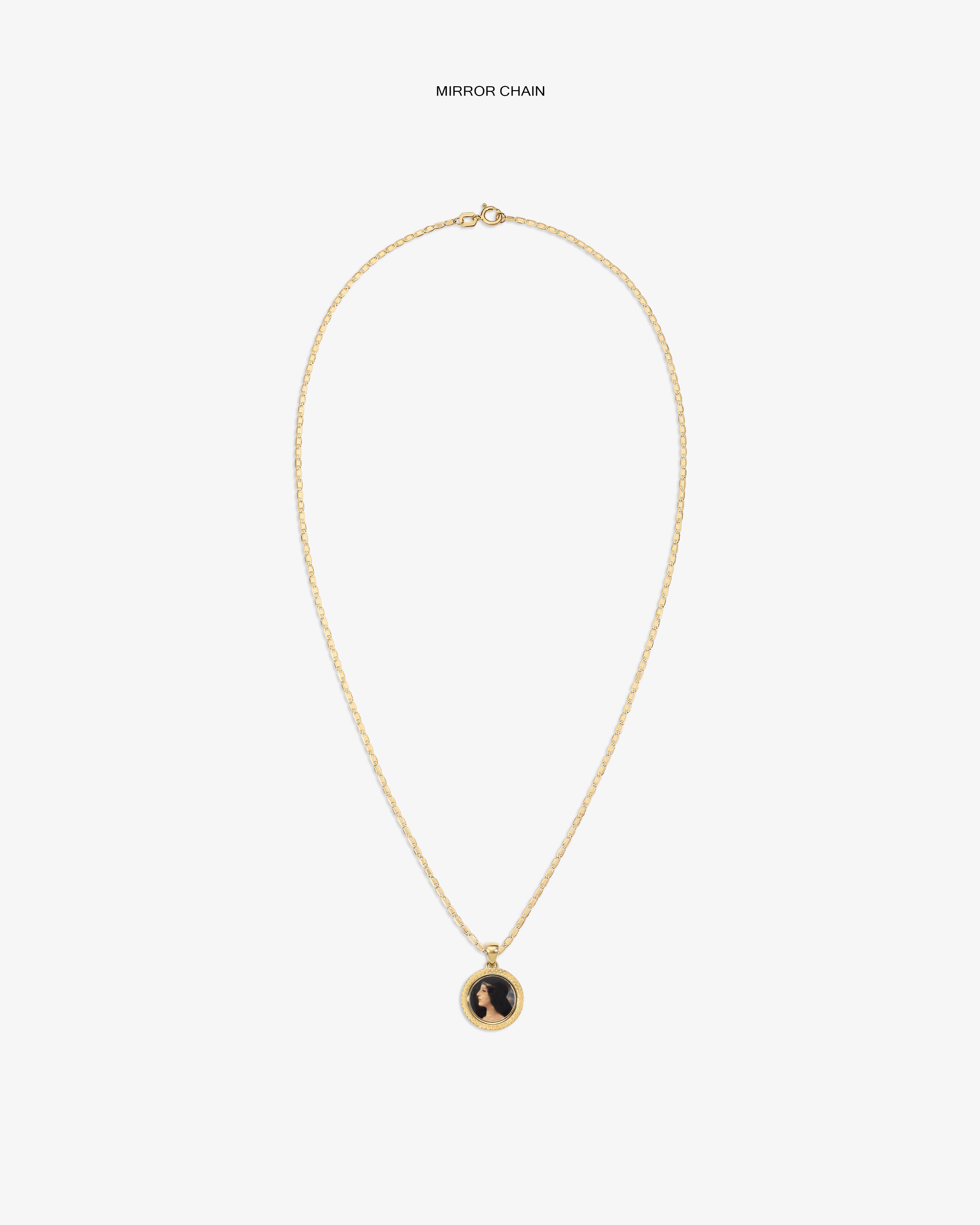 14Kt Gold Hera Pendant necklace with a round black and gold charm on a plain white background.