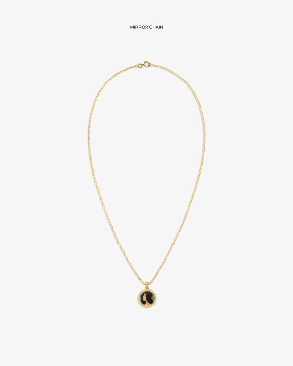 14Kt Gold Hera Pendant necklace with a round black and gold charm on a plain white background.