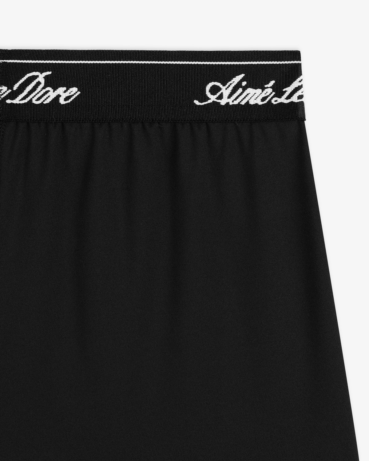Black Logo Biker Short with black elastic waistband and white cursive Aimé Leon Dore text.