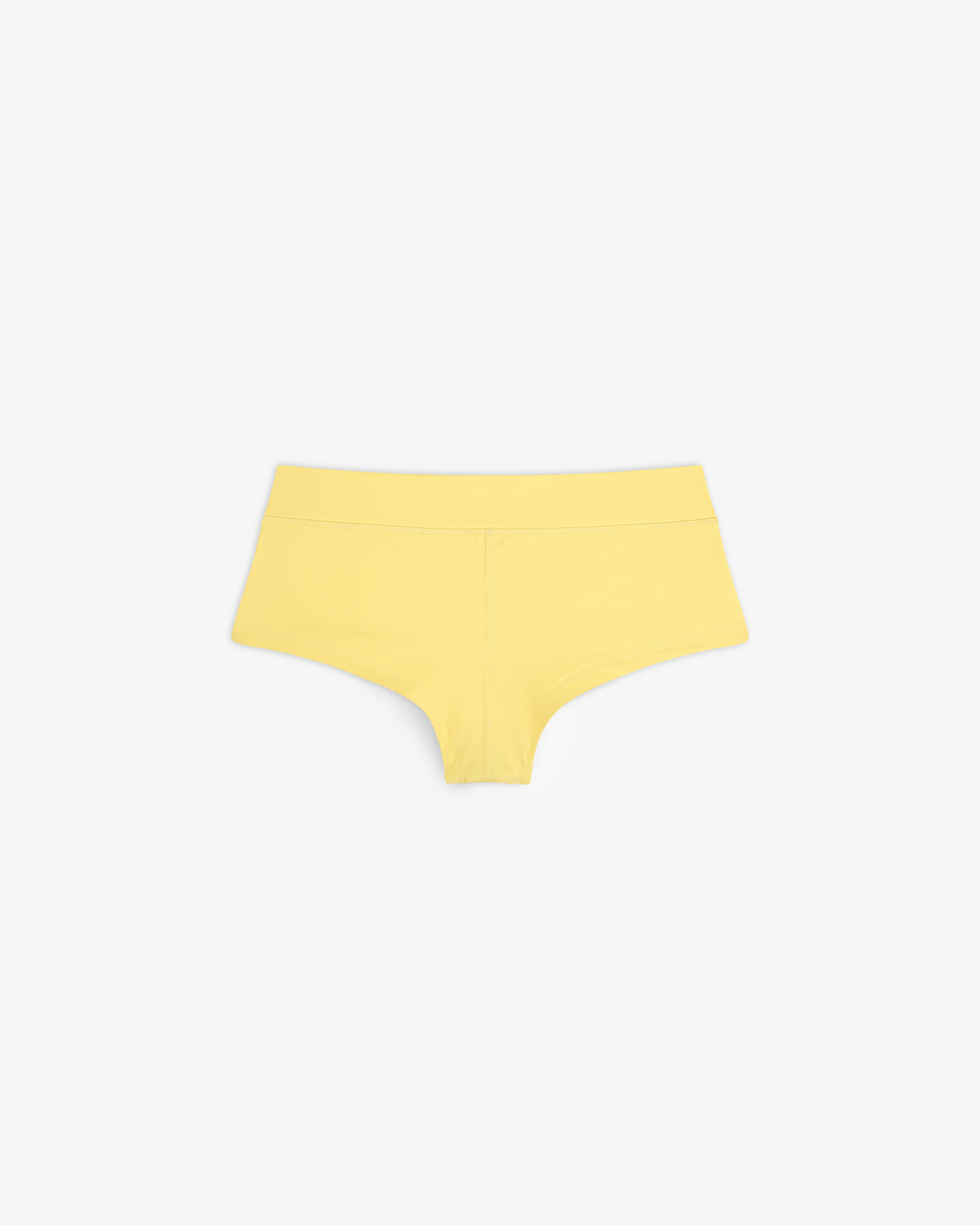 Crest Swim Short in yellow, seamless boyshort style, displayed flat on a white background.