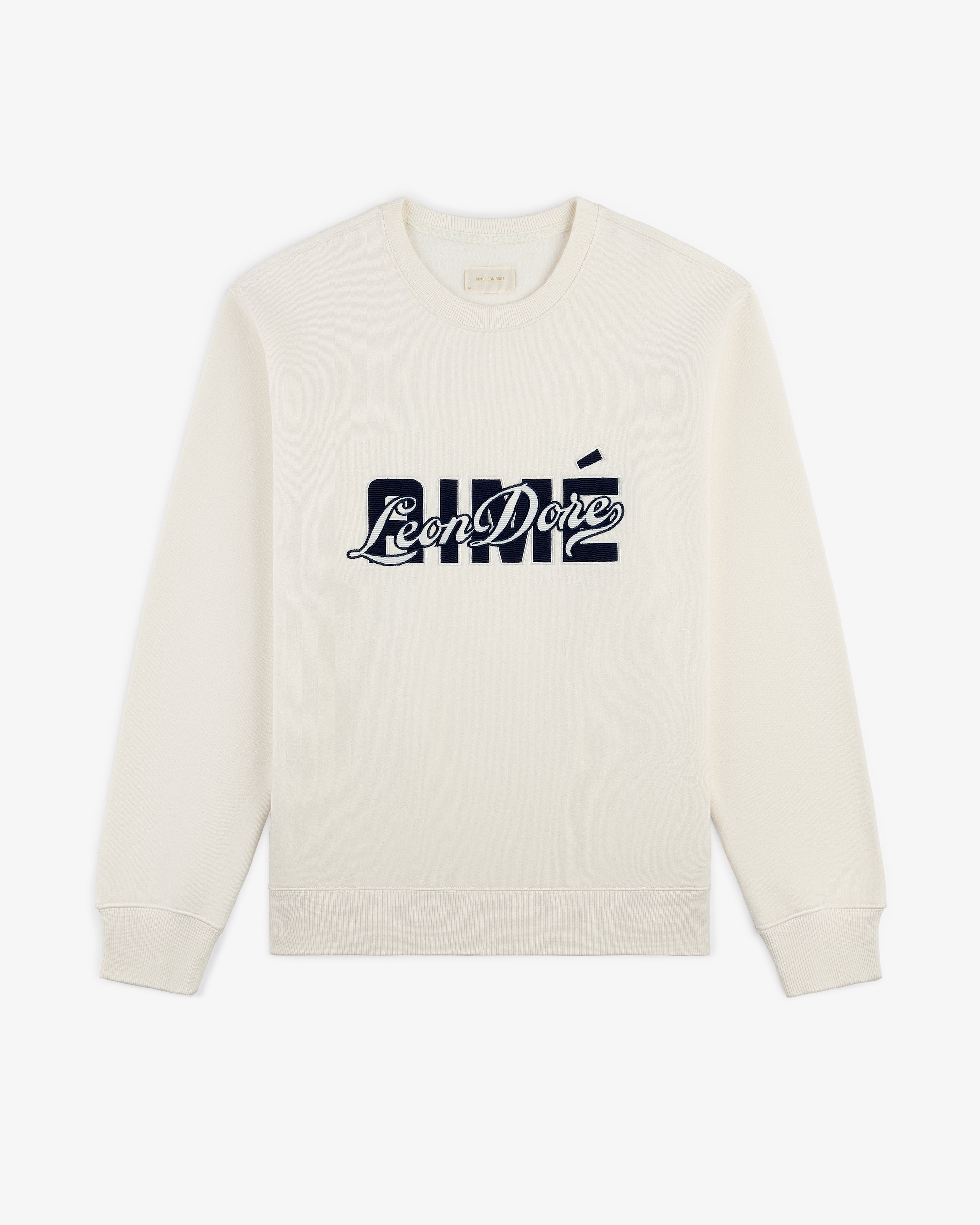 Ivory Overlay Logo Crewneck Sweatshirt with bold, dark blue Aimé Leon Dore logo across the chest.