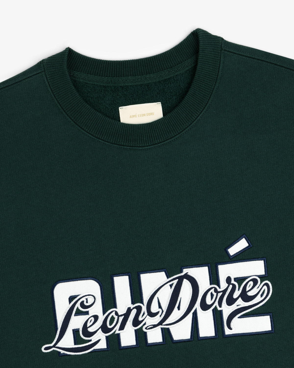 Dark green Overlay Logo Crewneck Sweatshirt with Aimé Leon Dore embroidered in white and navy on the front.