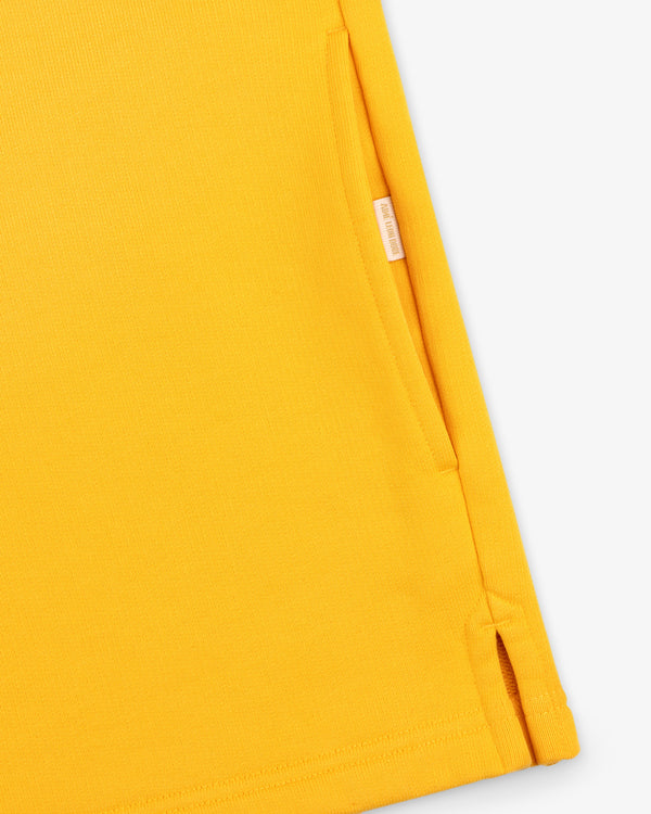 Close-up of the Sun Faded Crest Quarter Zip, highlighting its side pocket and small slit at the hem.
