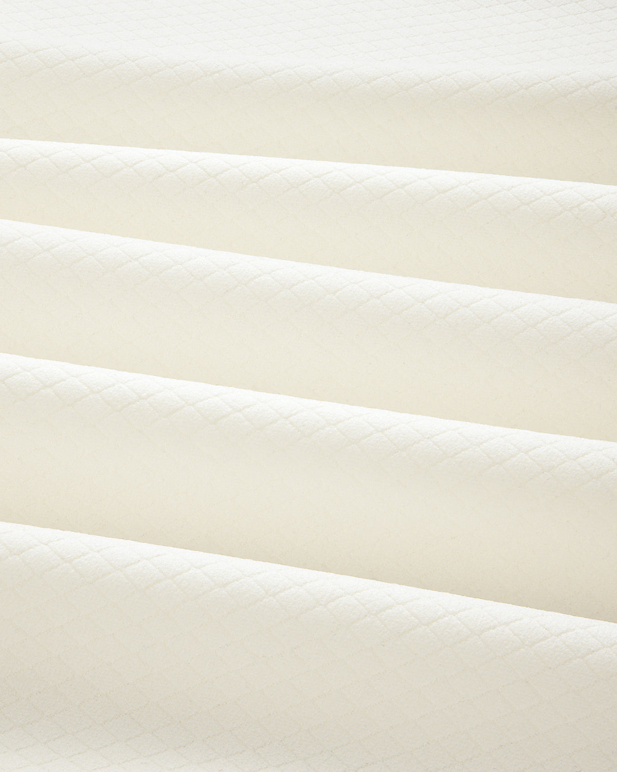 Cream-colored ALD Golf Quarter Zip Pullover in quilted fabric with a subtle diamond pattern and soft, even folds.