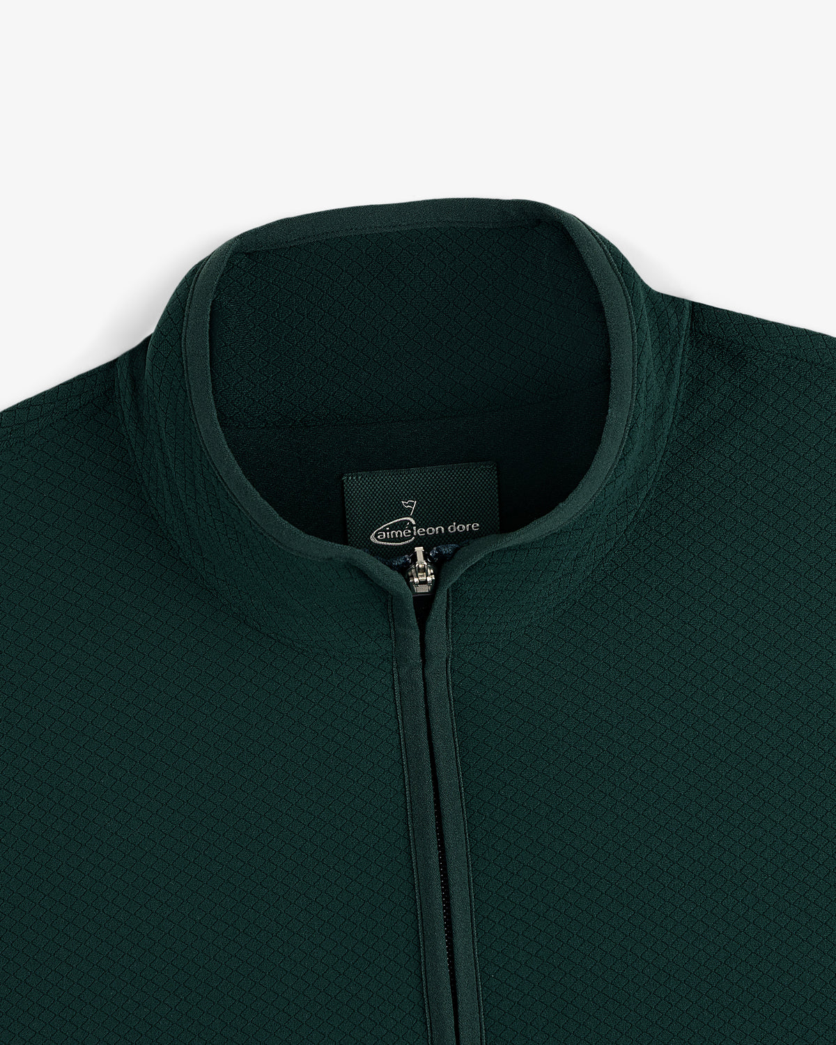 ALD Golf Quarter Zip Pullover in dark green with textured fabric and stand collar, shown neck down on white background.
