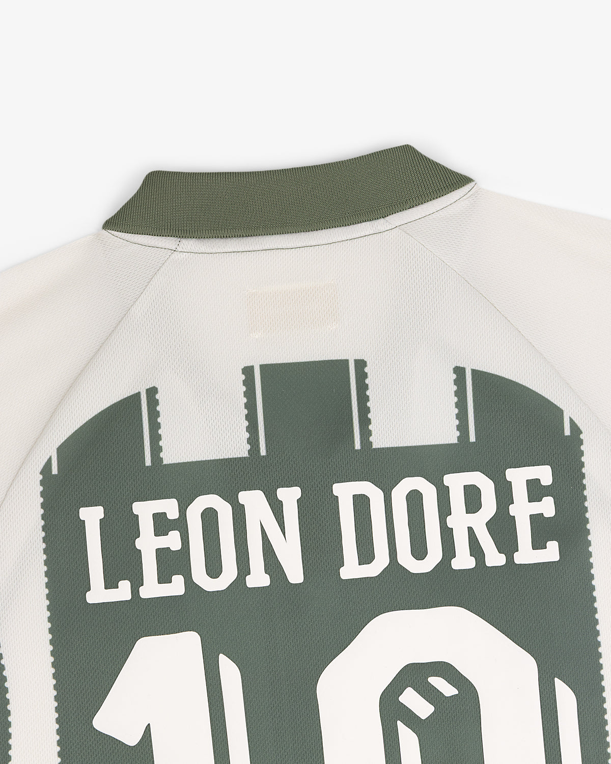 Close-up of Aimé Cup Soccer Jersey back with LEON DORE and number 10 in green and white.