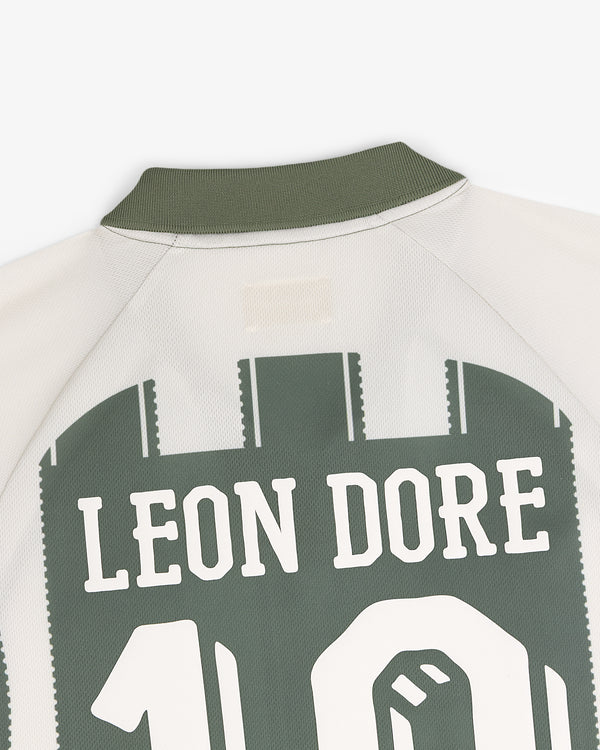 Close-up of Aimé Cup Soccer Jersey back with LEON DORE and number 10 in green and white.