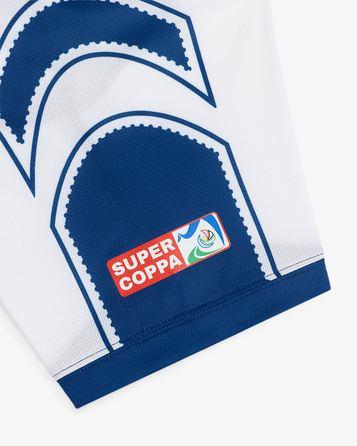 Close-up of the Aimé Cup Soccer Jersey, white with blue accents and a Super Coppa patch above the hem.