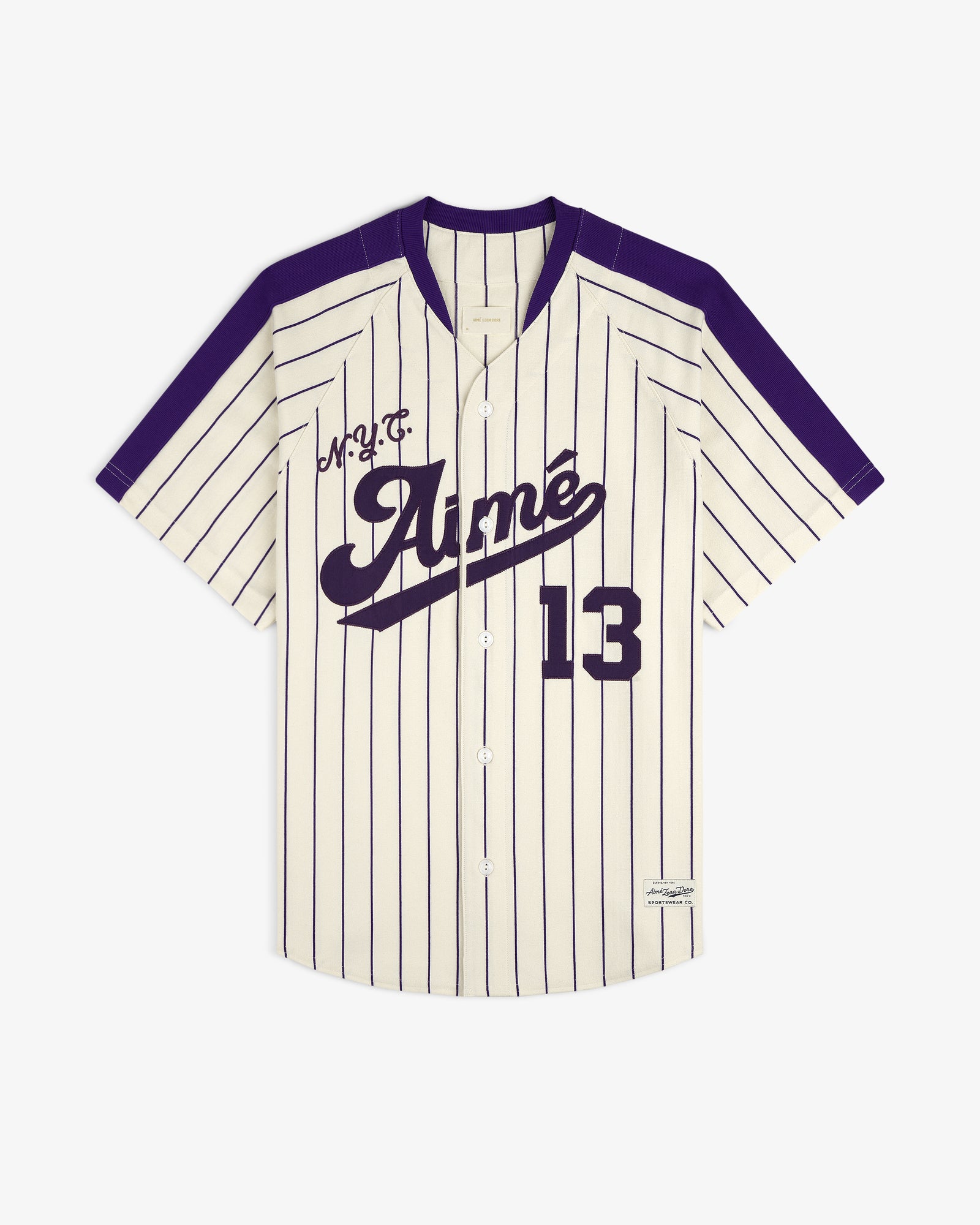 Cream and purple pinstriped Aimé Baseball Jersey with “Aimé” and 13 on the front.
