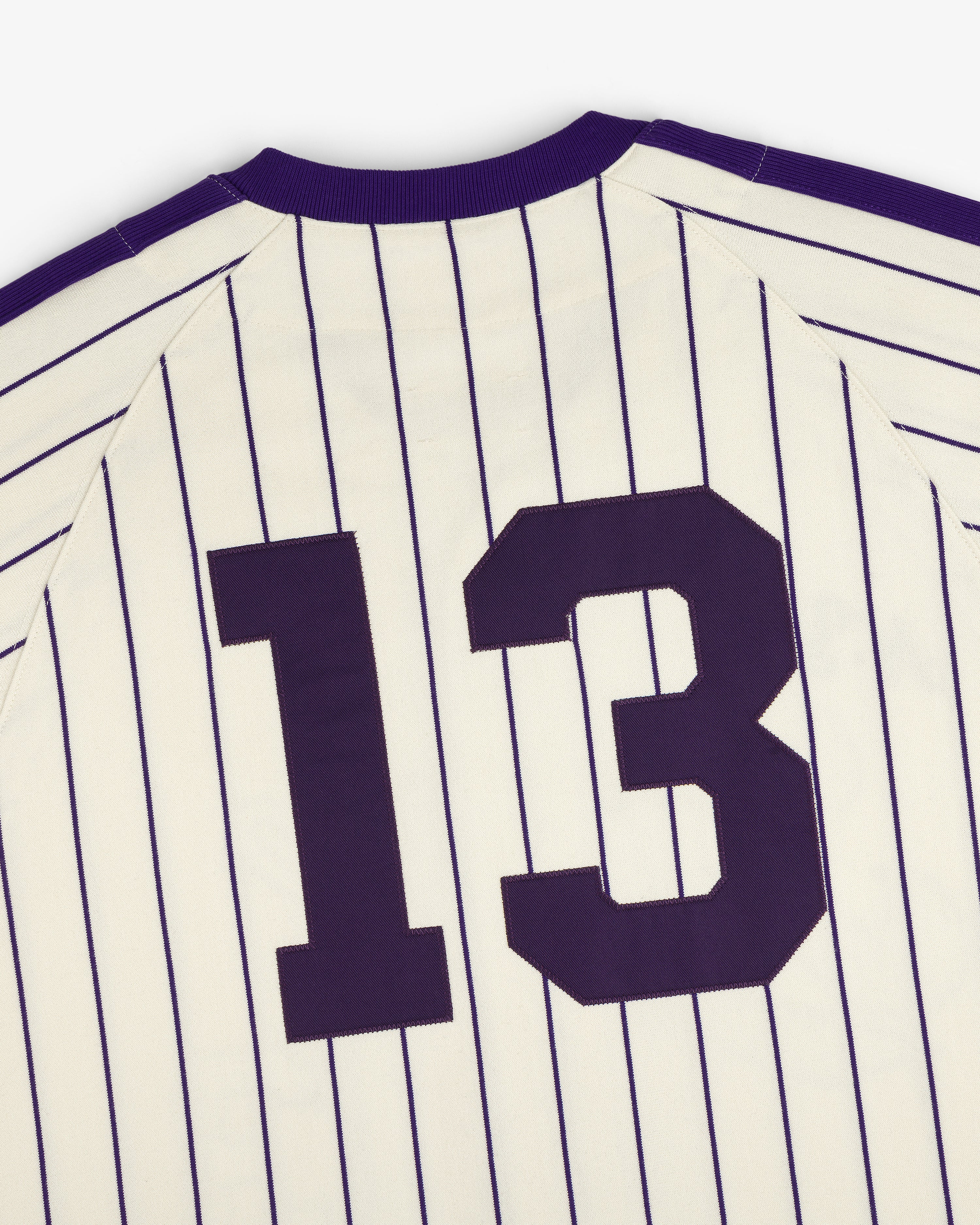Aimé Baseball Jersey: white with thin navy stripes and large dark number 13 on the back.