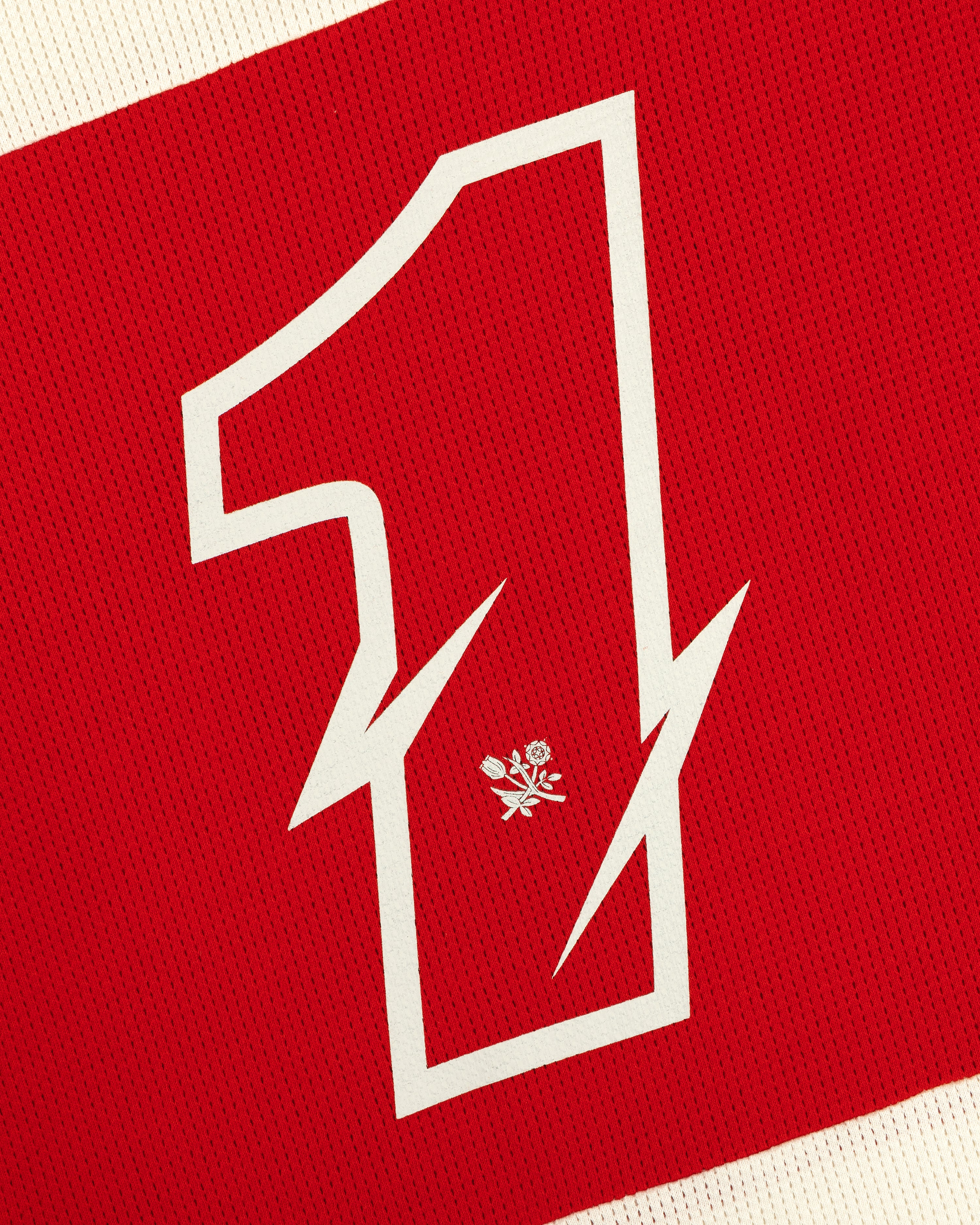 A sharp white number 1 with a rose and swords on red textured Long-Sleeve Mesh Enduro Tee.
