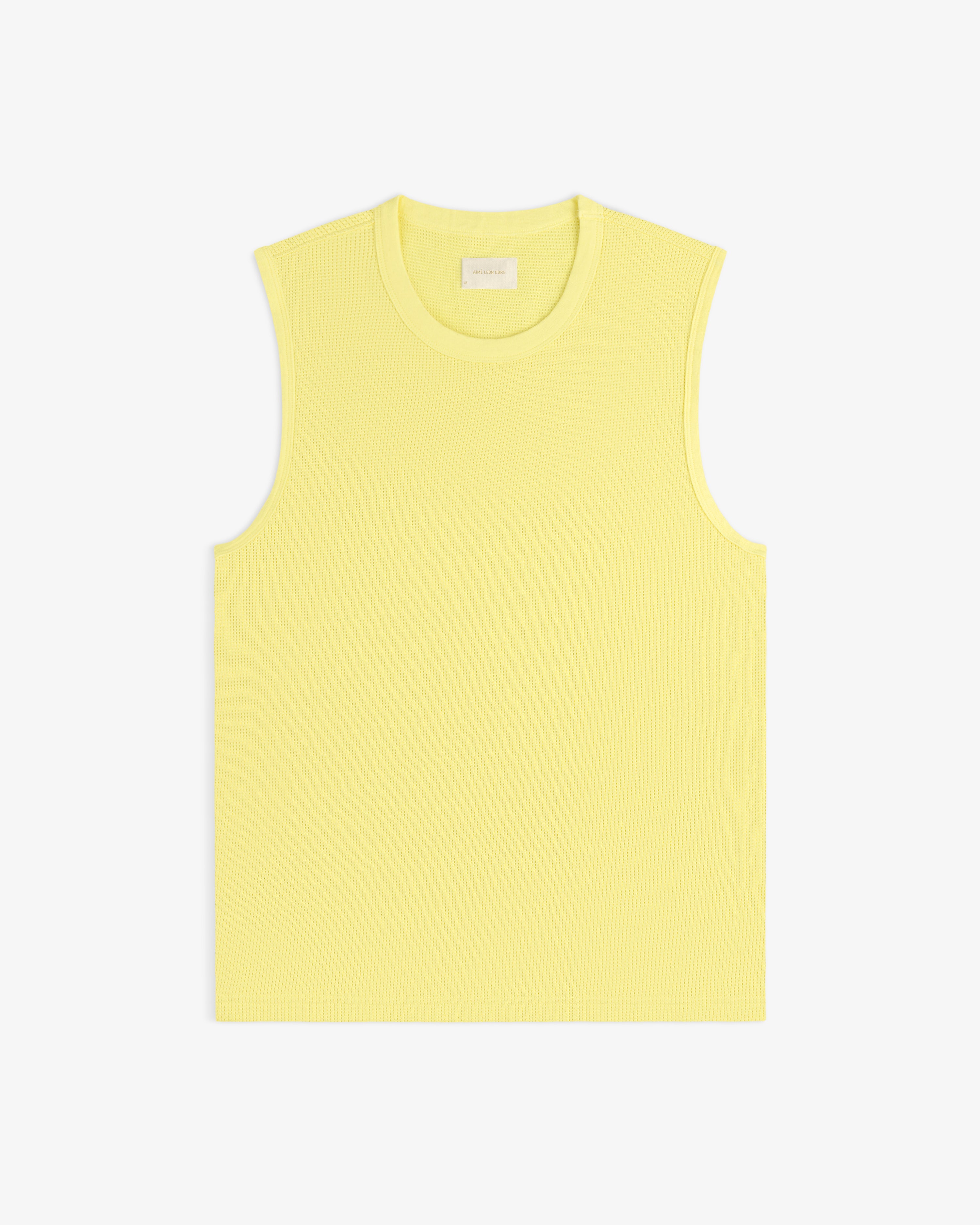 Mesh Muscle Tank in light yellow, sleeveless and ribbed, displayed flat on a white background.