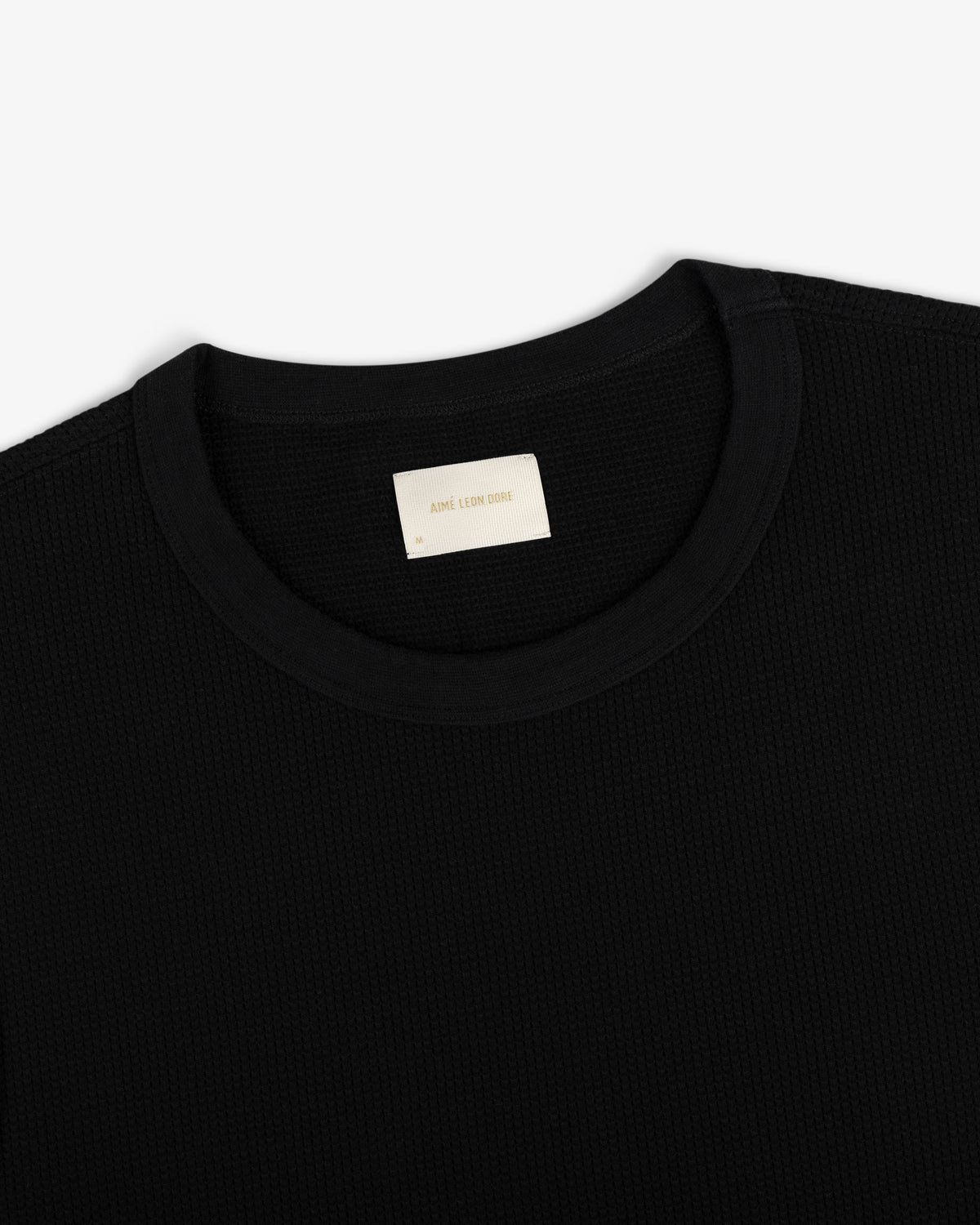 Mesh Muscle Tank with a small beige label inside the collar on a white background.