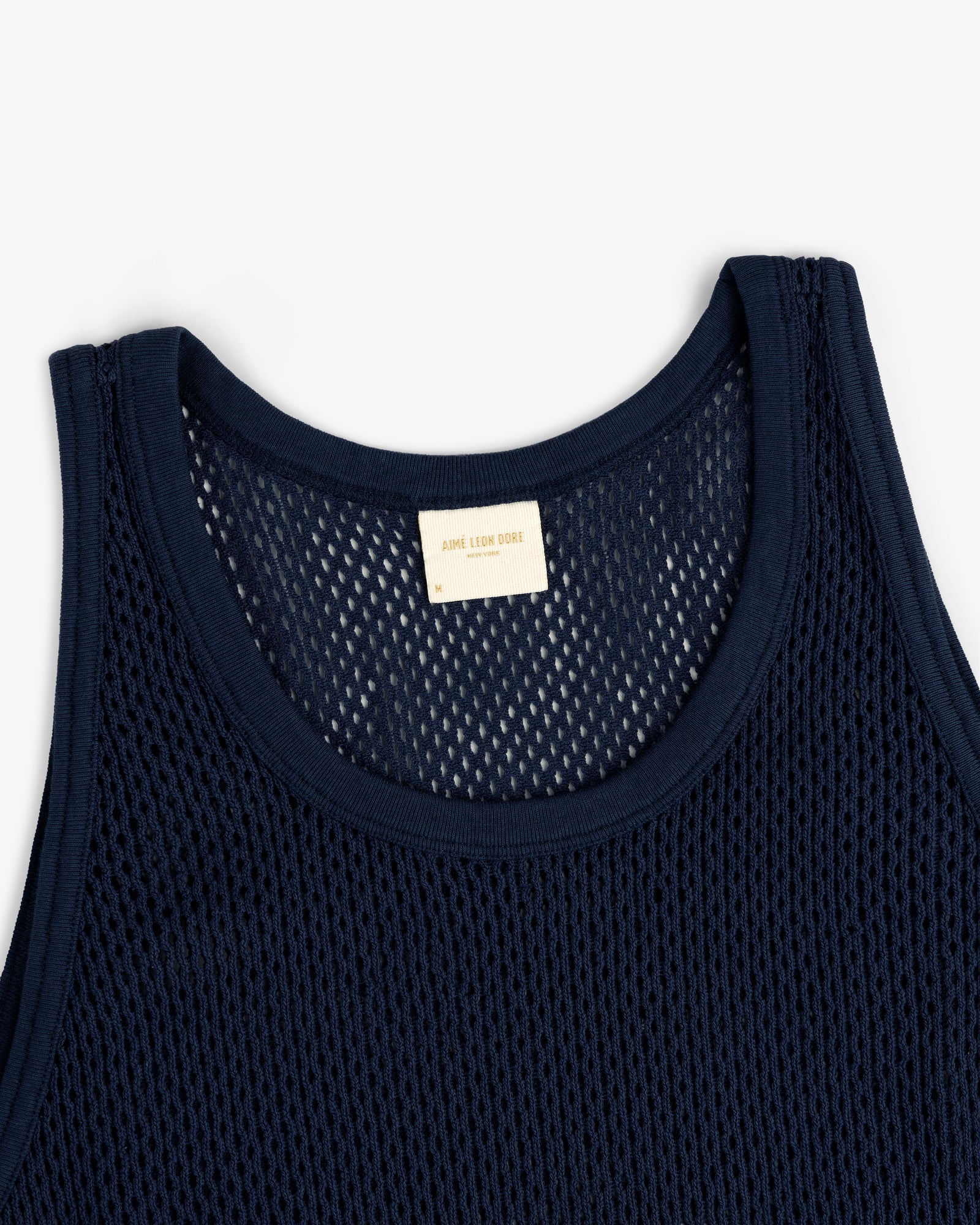 Navy blue Mesh Tank Top with woven texture and beige inner neckline label.