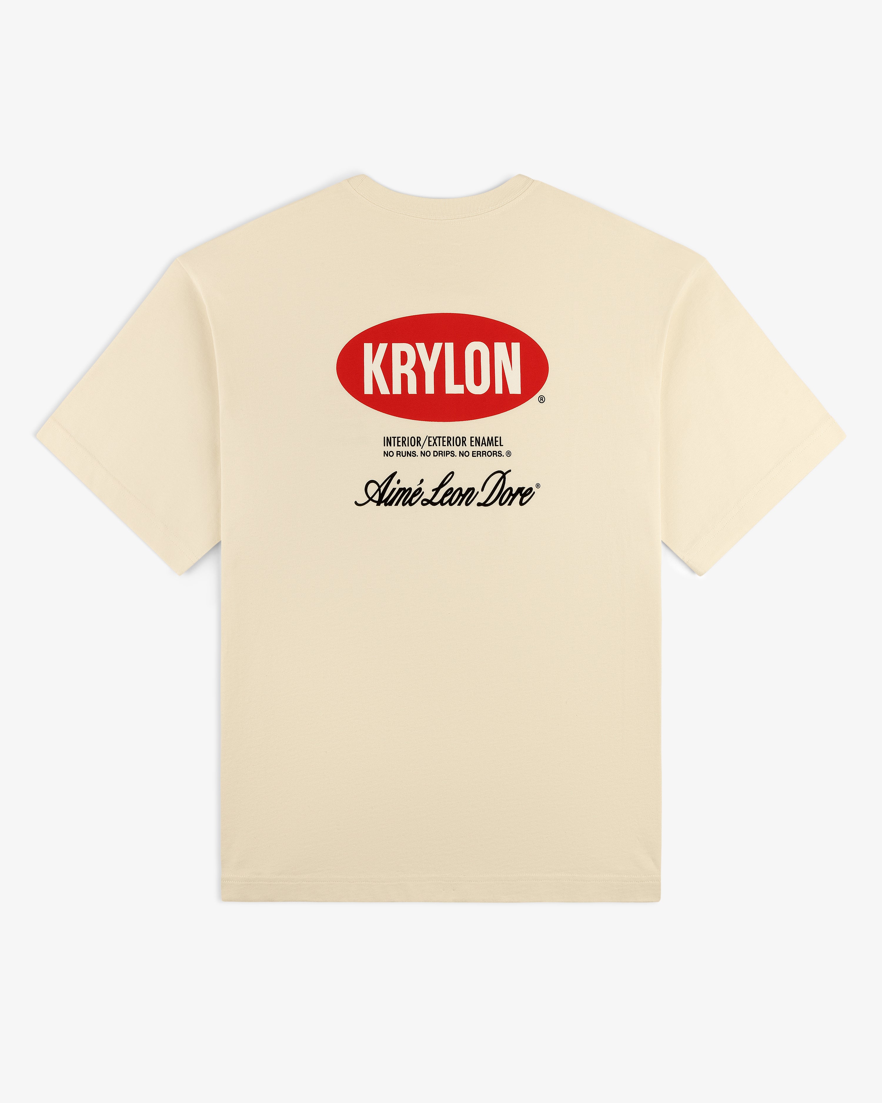 Back of beige Krylon Logo Tee with red KRYLON logo and black Aimé Leon Dore text printed below.