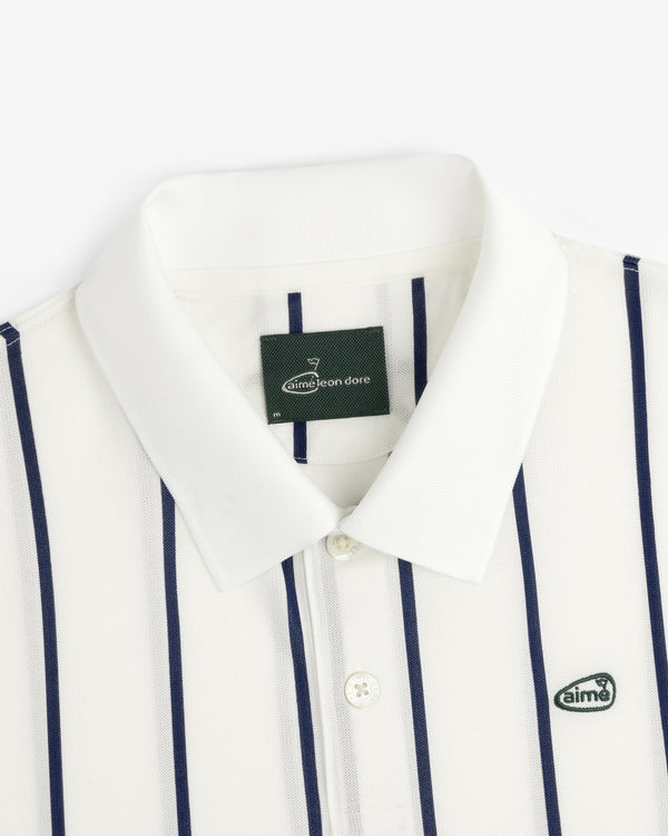 ALD Golf Polo: white collared shirt with navy stripes and "aimé" logo patch on the chest.