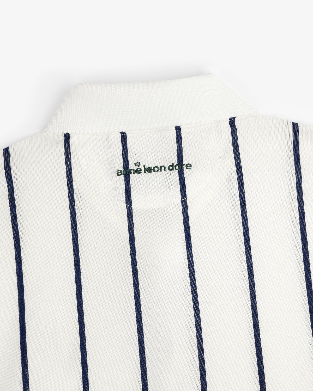 ALD Golf Polo: White collared shirt with vertical navy stripes and green logo inside the collar.