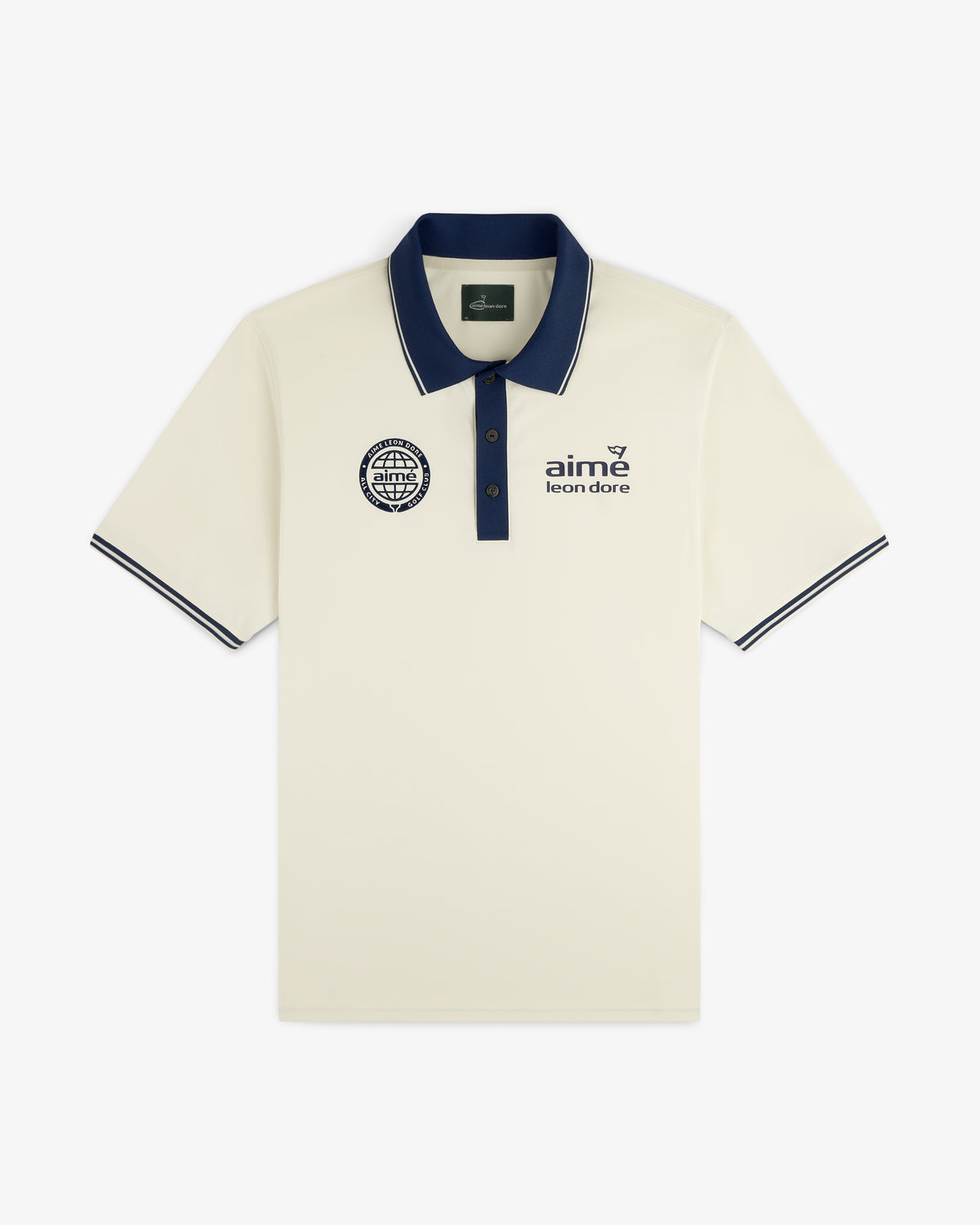 ALD Golf Tour Polo in cream with dark blue collar, sleeve trim, and chest logos, laid flat on white background.