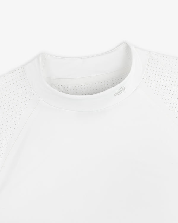 Close-up of the ALD Golf Performance Tee, featuring perforated raglan sleeves and a crew neck on a white background.