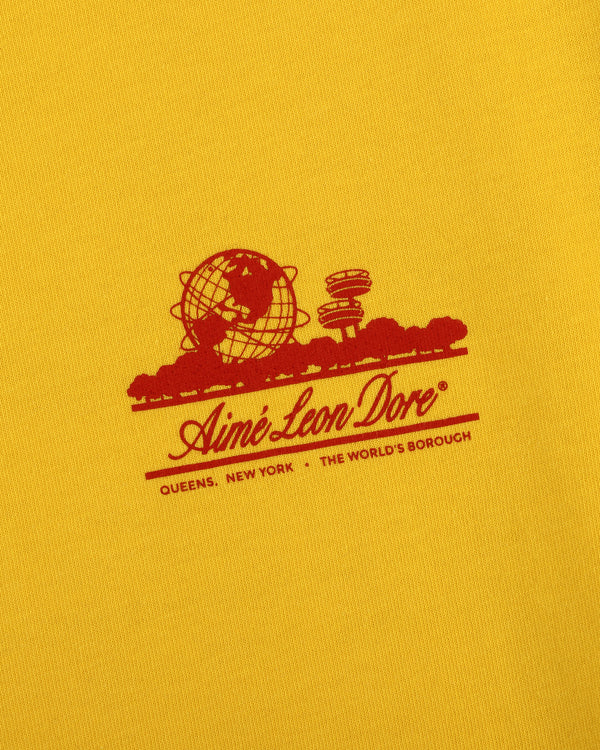 Sun Faded Unisphere Tee featuring a red Aimé Leon Dore logo with globe and "Queens, New York - The Worlds Borough" text.
