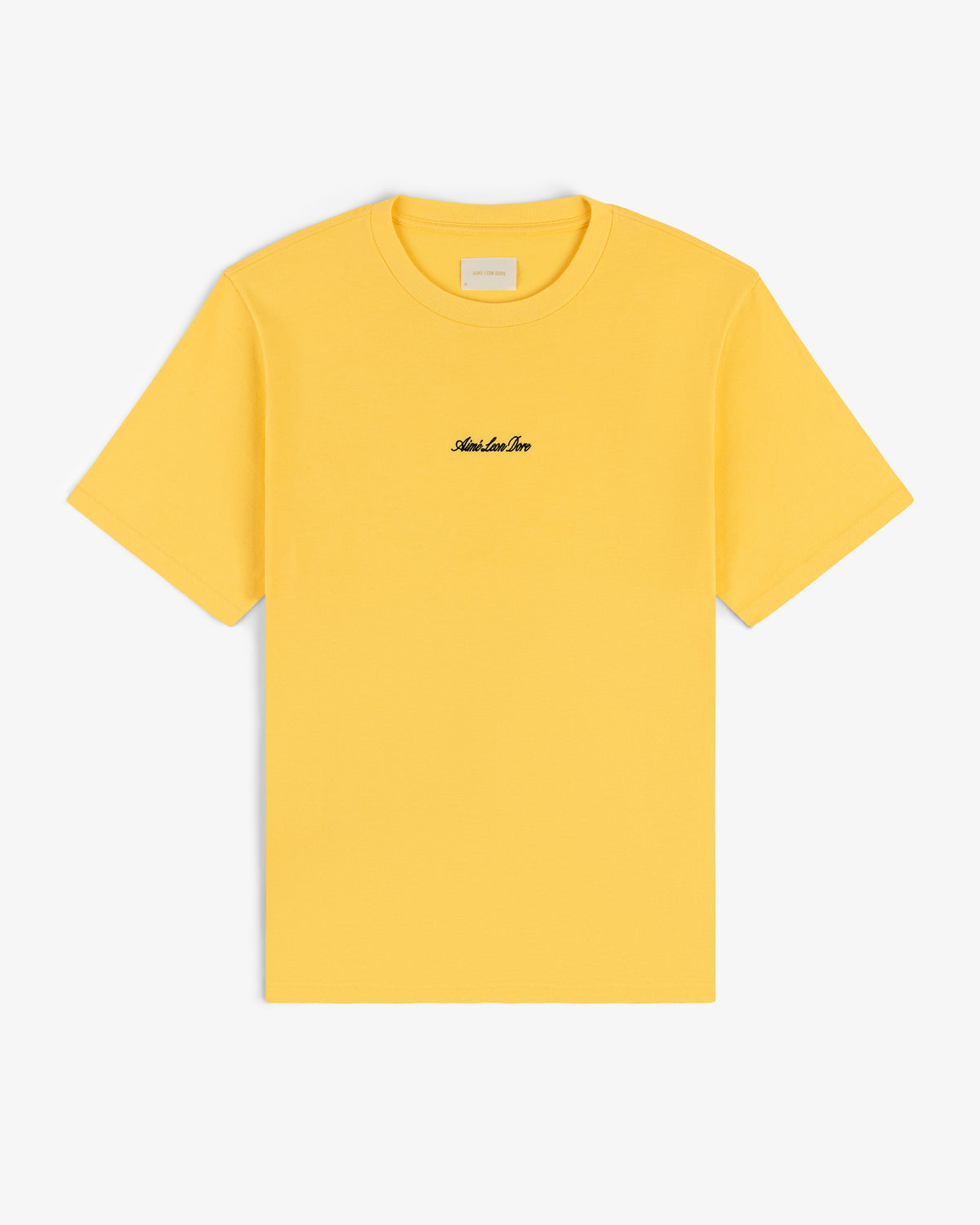 Embroidered Logo Tee in yellow with small black chest embroidery, shown on a white background.