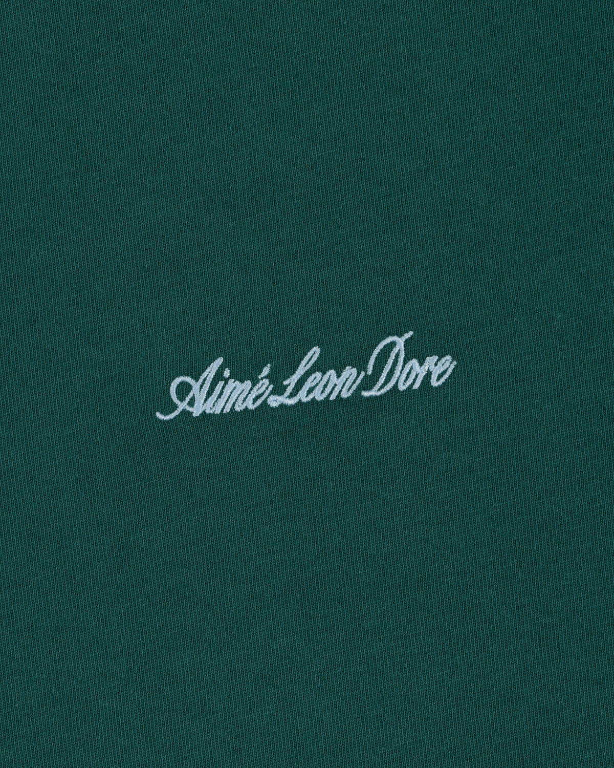 Green Embroidered Logo Tee featuring Aimé Leon Dore in white cursive at the center.