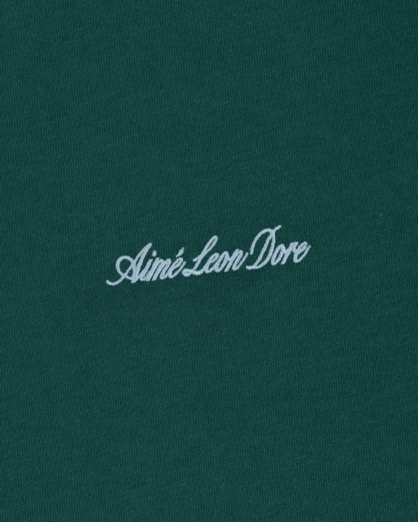 Green Embroidered Logo Tee featuring Aimé Leon Dore in white cursive at the center.