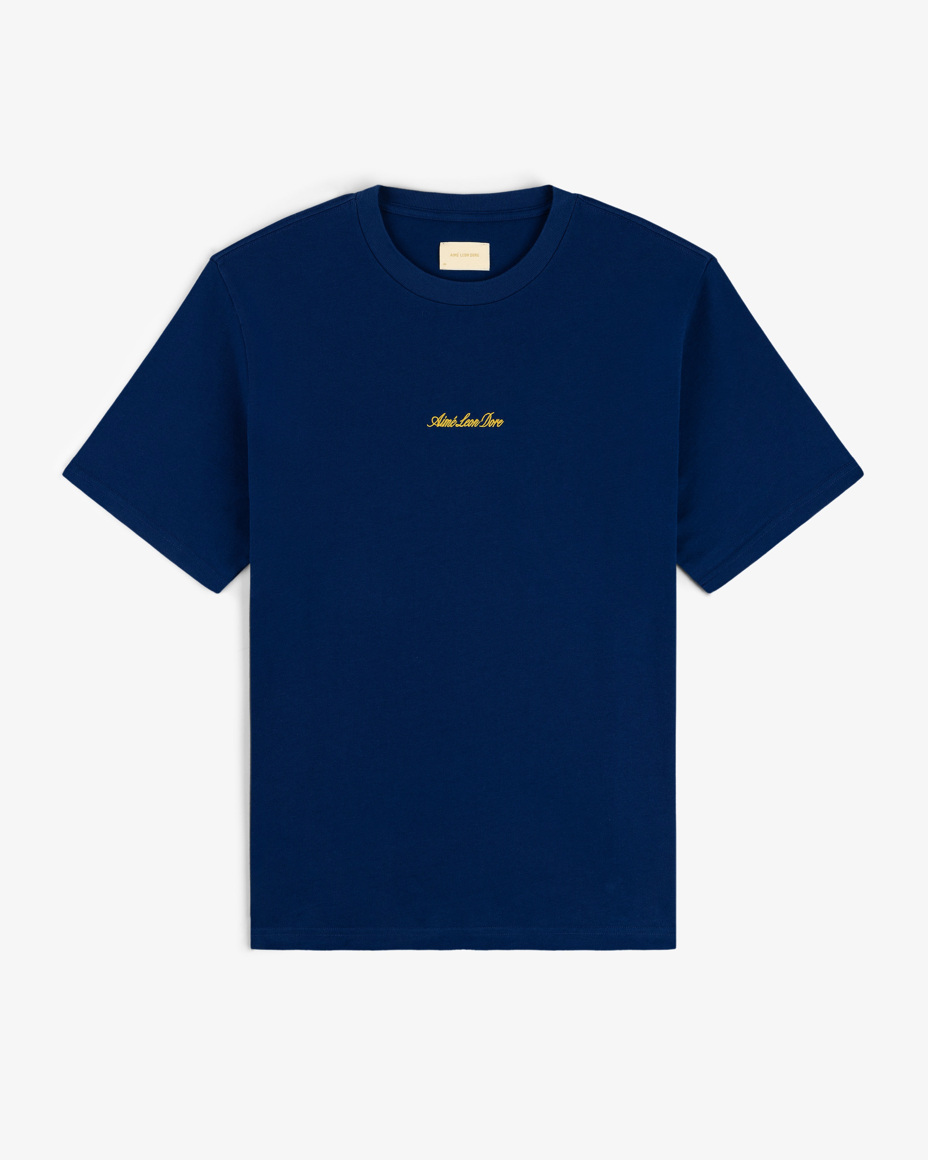 Navy Embroidered Logo Tee with short sleeves and small gold text centered on the chest.