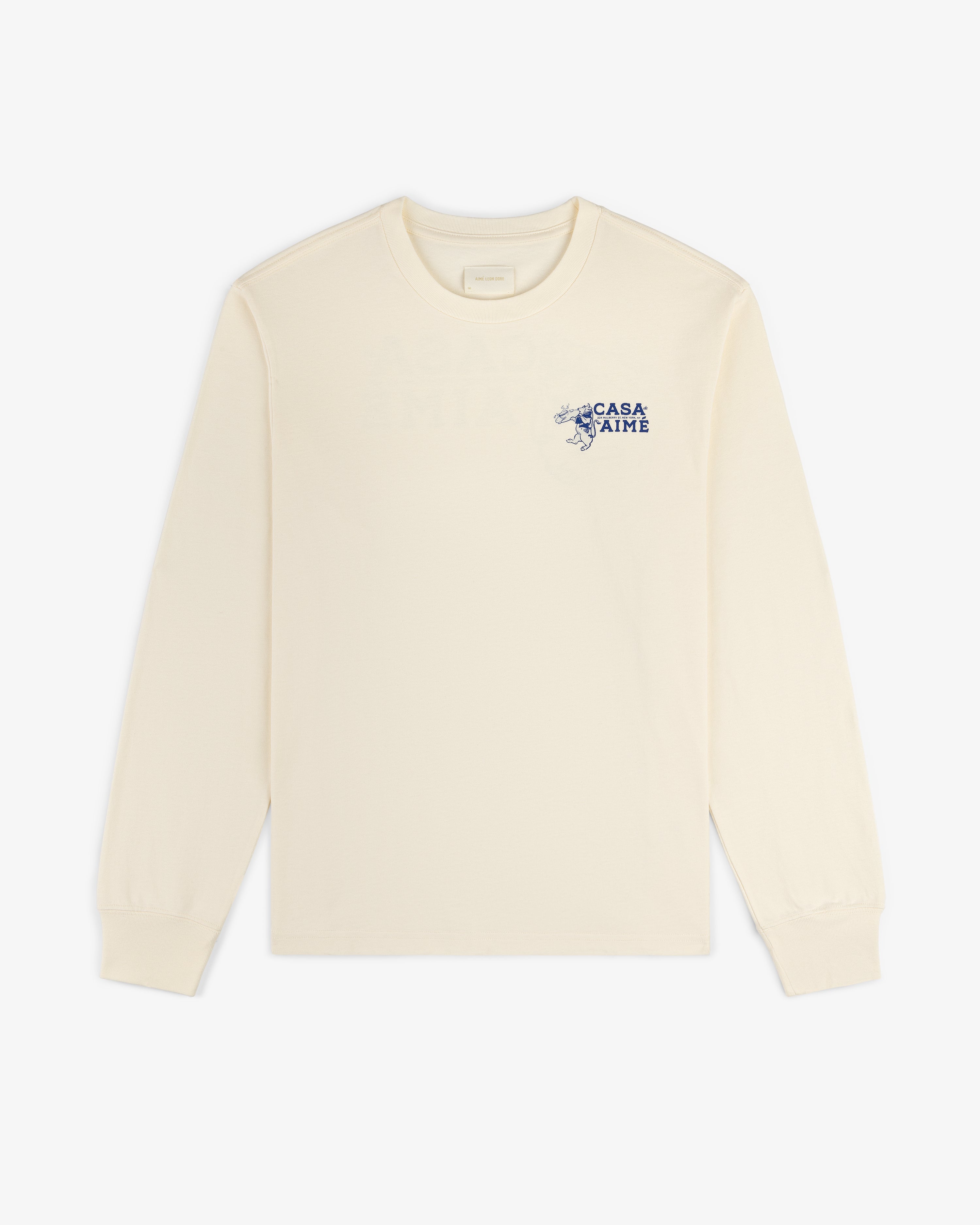 Cream-colored Long-Sleeve Casa Tee with small blue text and graphic on the upper left chest.
