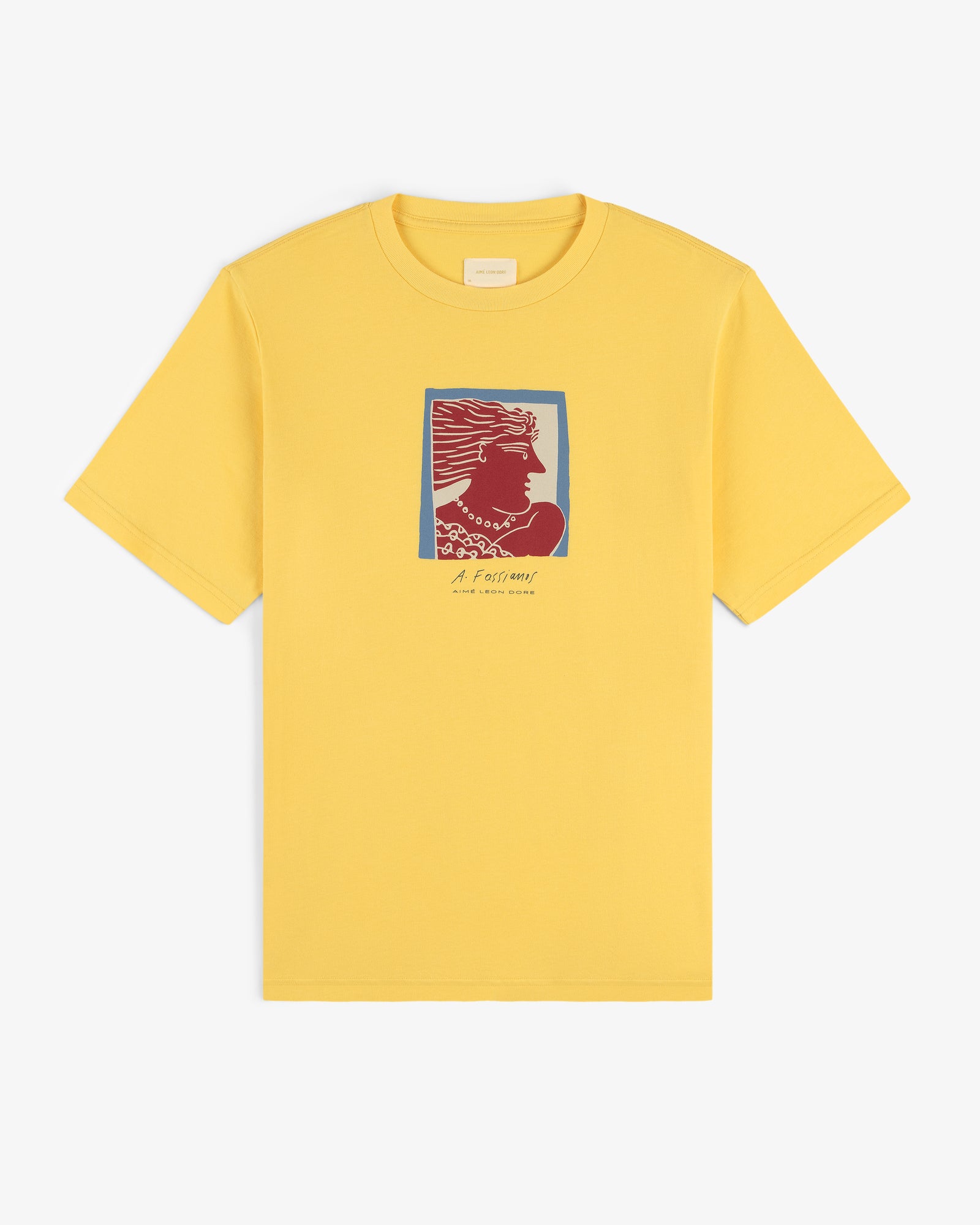 The Fassianos Portrait Tee is a yellow t-shirt featuring a red and blue head graphic with small text below.
