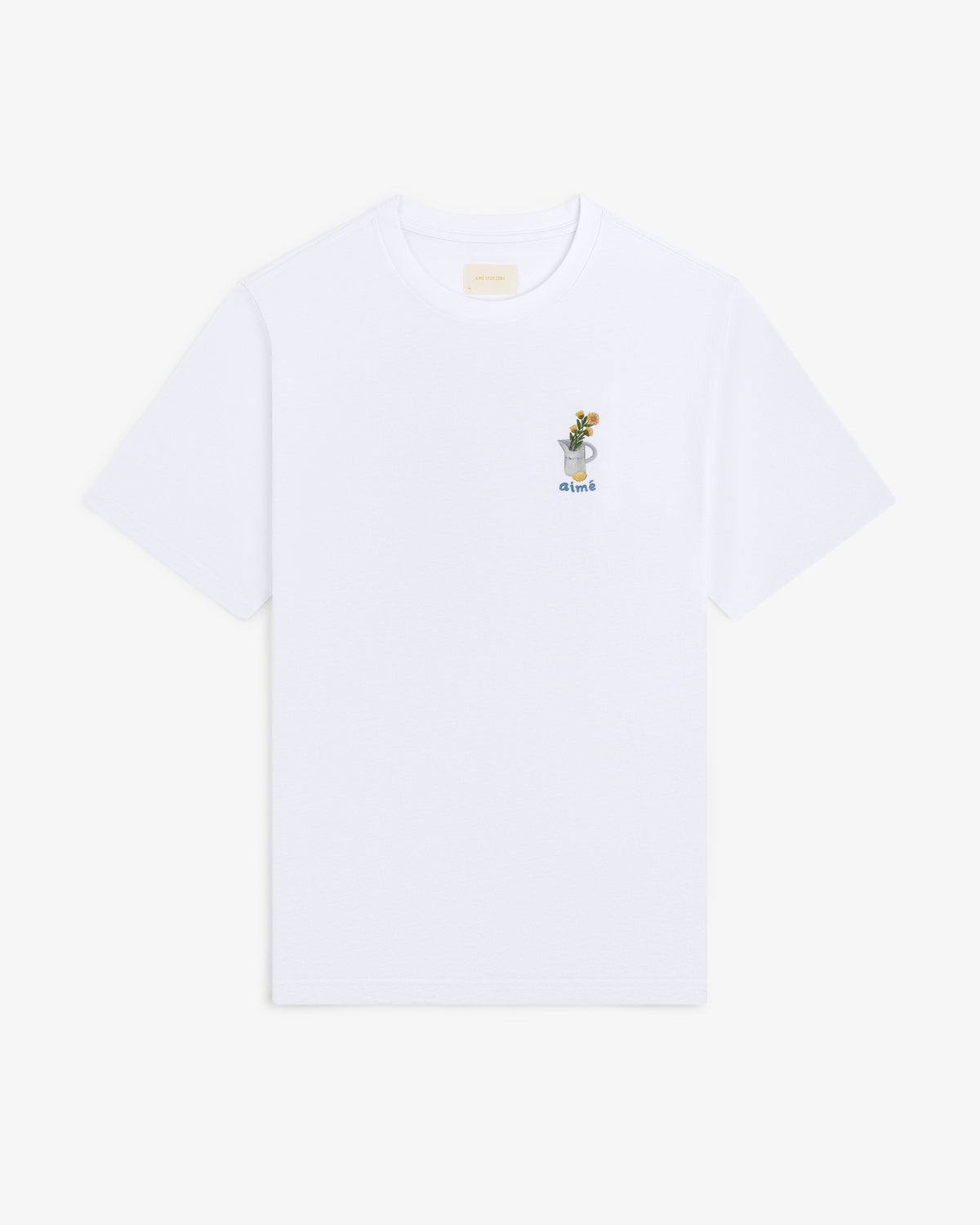 Breakfast Tee: White T-shirt featuring a small embroidered drink graphic and the word "drink" on the upper left chest.