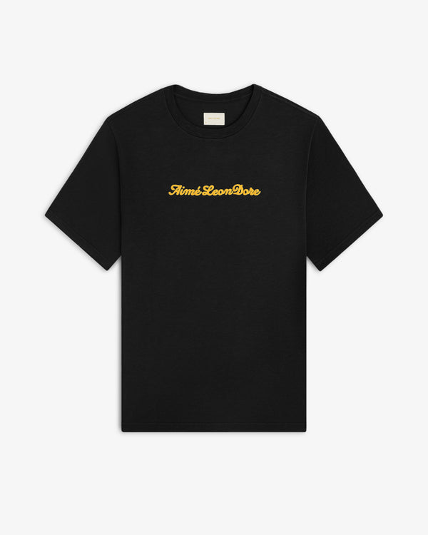 Black Puff Print Slub Logo Tee with Aimé Leon Dore in yellow cursive text across the chest.