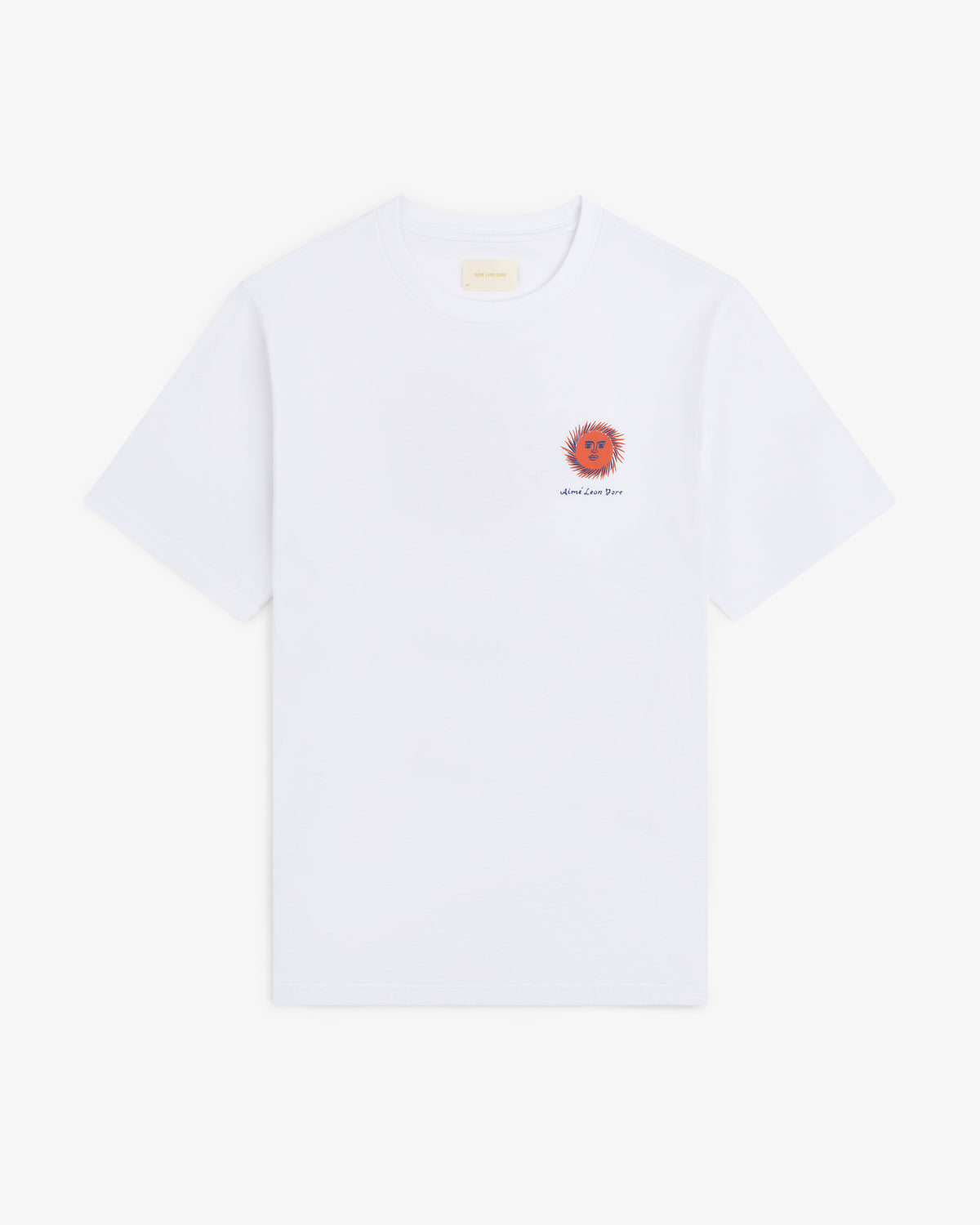 Fassianos "Sovereign Sun" Tee: white shirt with small orange sun and text on left chest, shown on plain background.