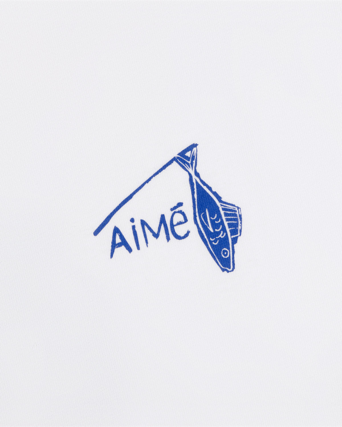 Blue fish illustration and "Aimé" on white background, featured on the Fisherman Tee.