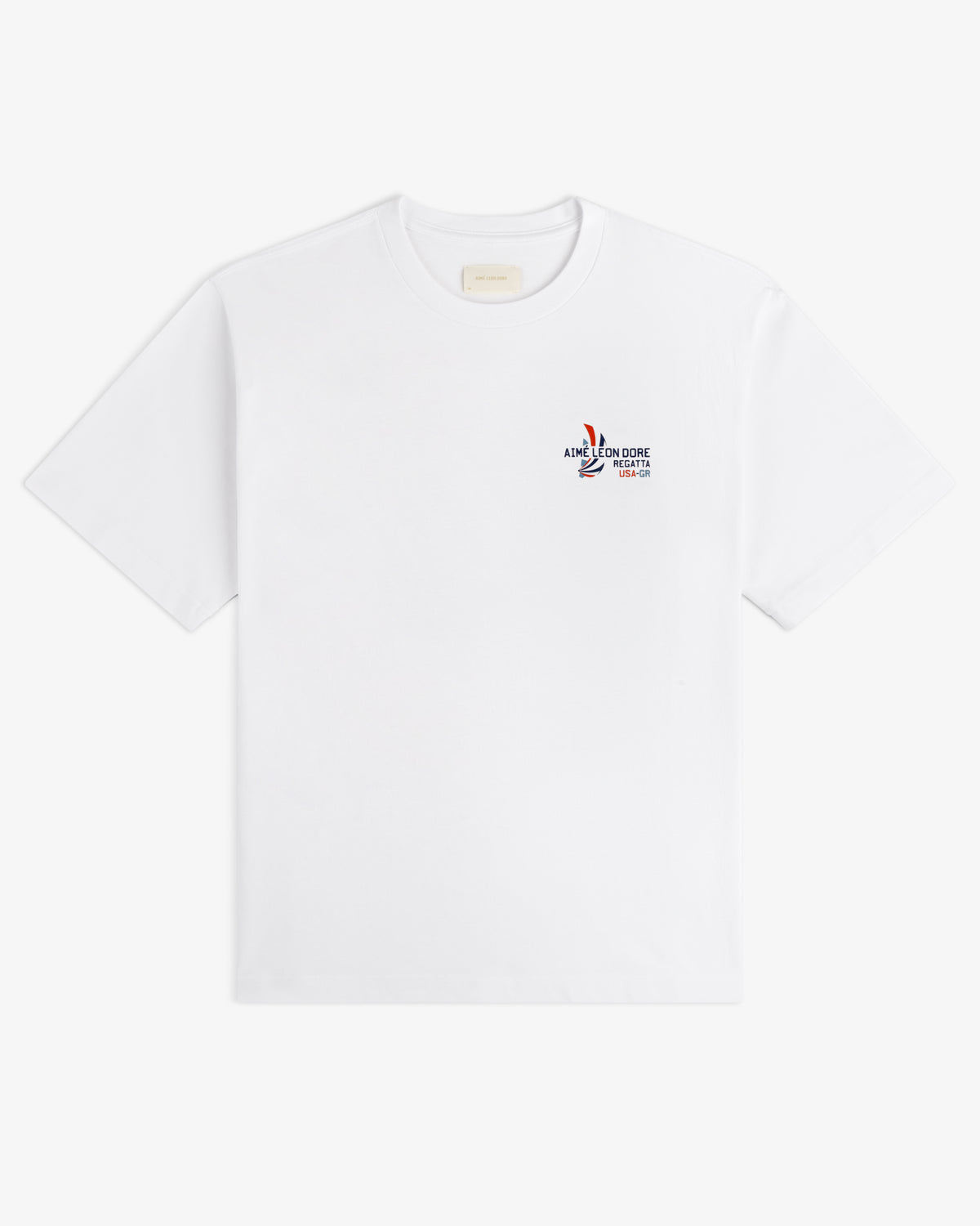 Regatta Tee: white short-sleeve t-shirt with small multicolor graphic and text on left chest.