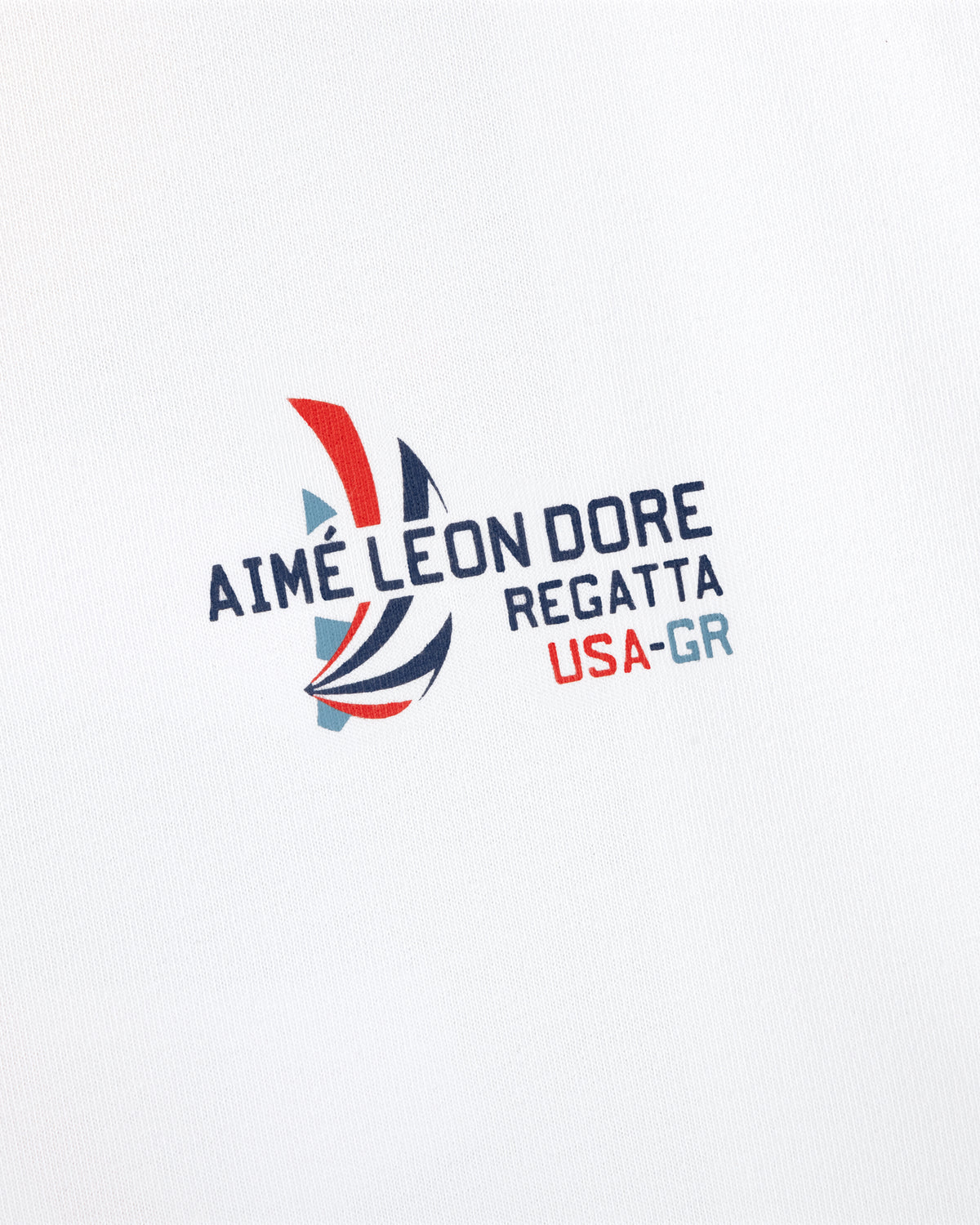 The Regatta Tee features "AIMÉ LEON DORE REGATTA USA-GR" and a red, blue, gray sailboat on white fabric.
