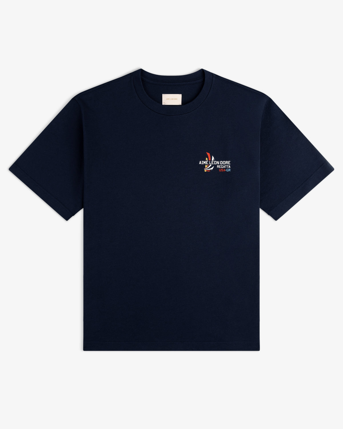 Regatta Tee in navy blue with a small colorful embroidered graphic and text on the left chest.