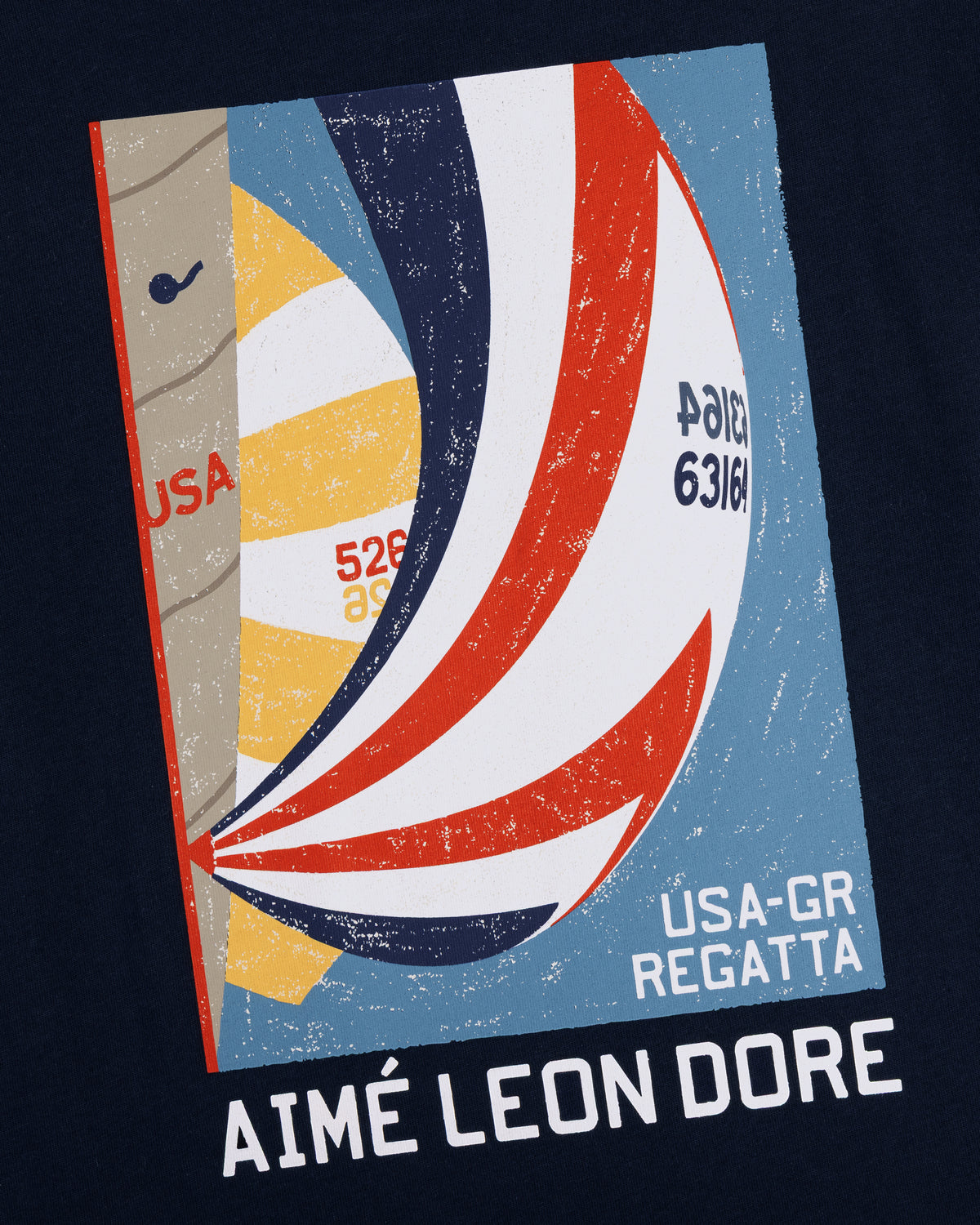 Illustration of colorful sailboats with USA-GR Regatta and Aimé Leon Dore text on the Regatta Tee's textured blue background.
