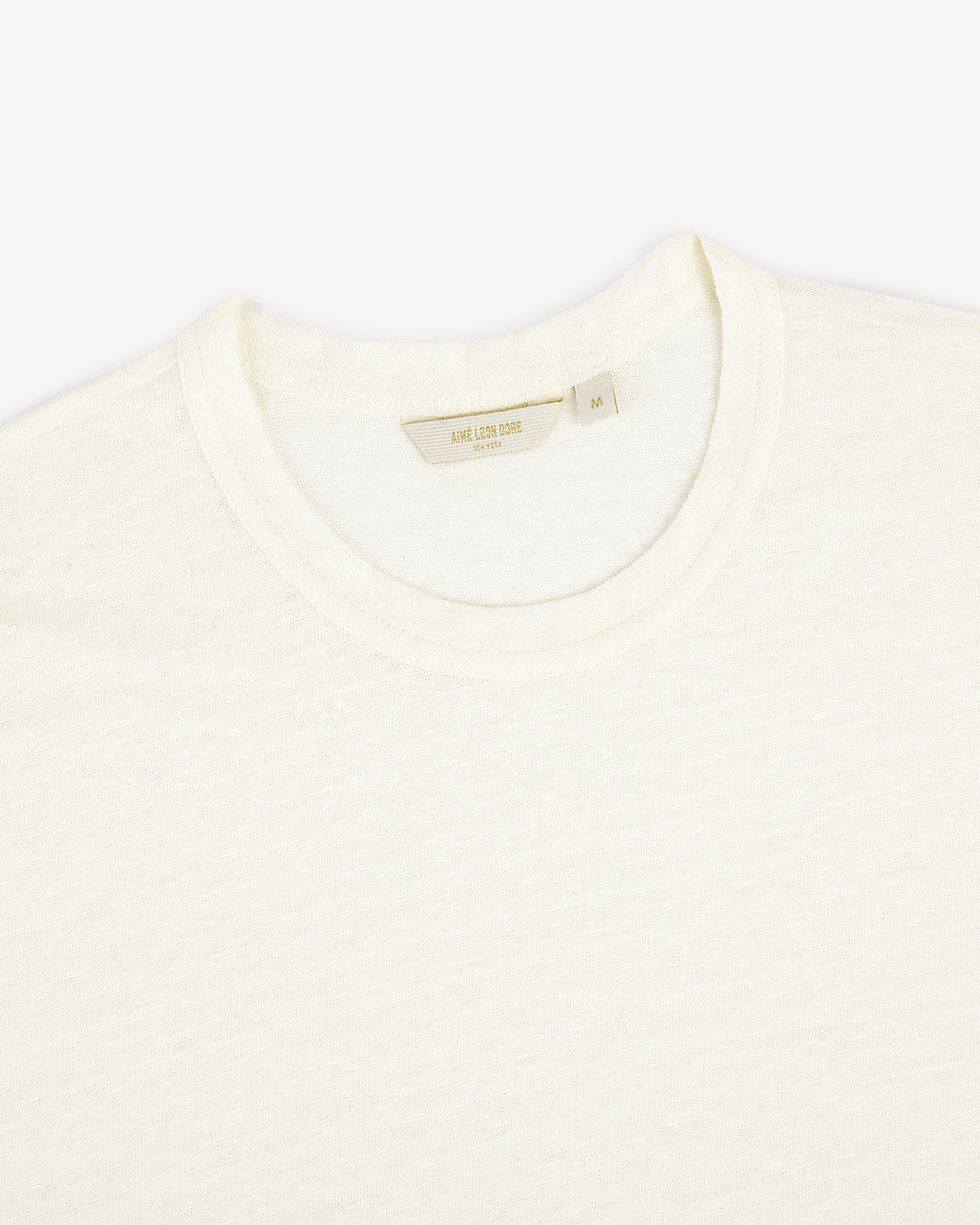 Linen Tee in off-white, size medium, laid flat on a white background.