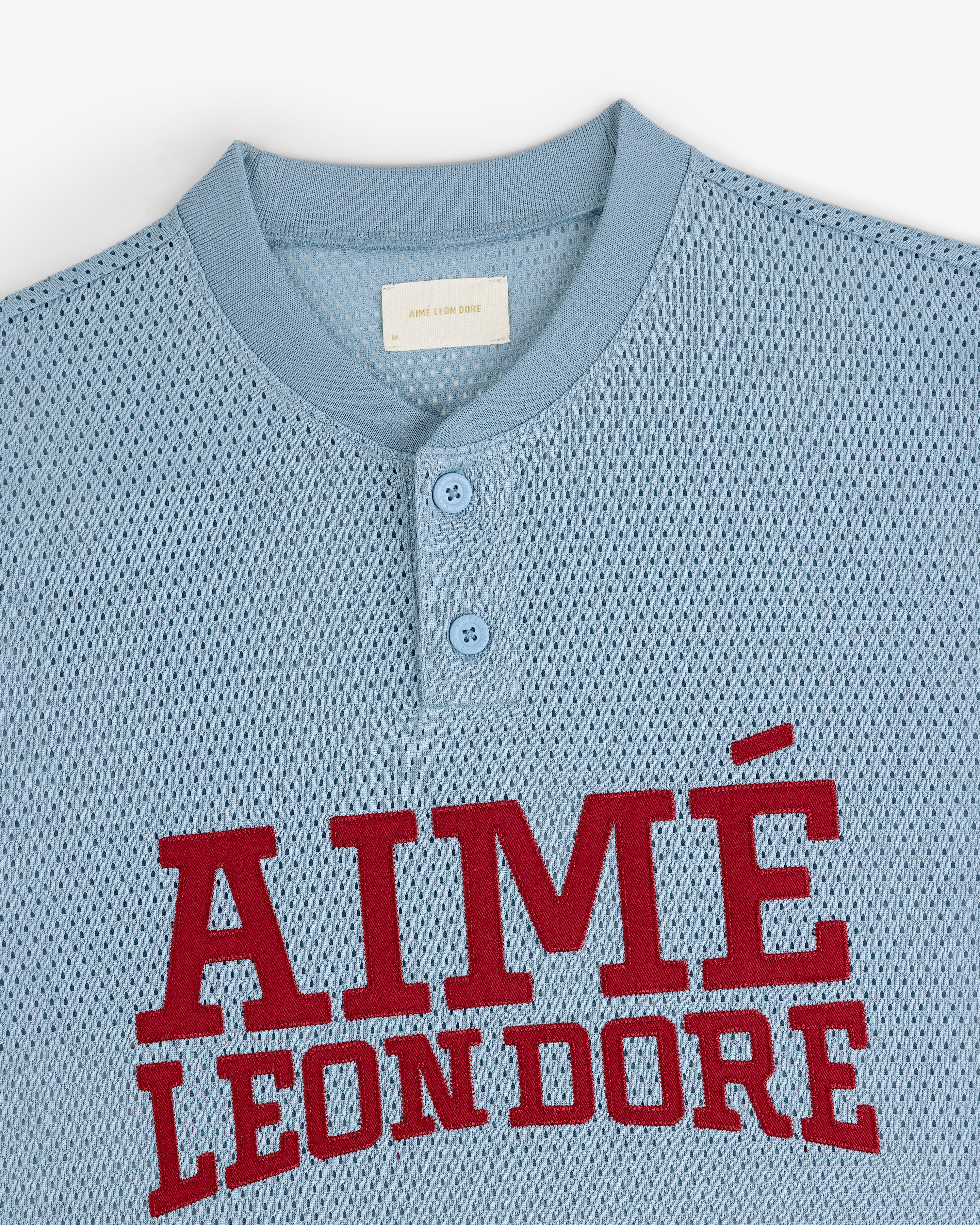Light blue Mesh Batting Practice Jersey with two buttons and AIMÉ LEON DORE in large red letters on the chest.