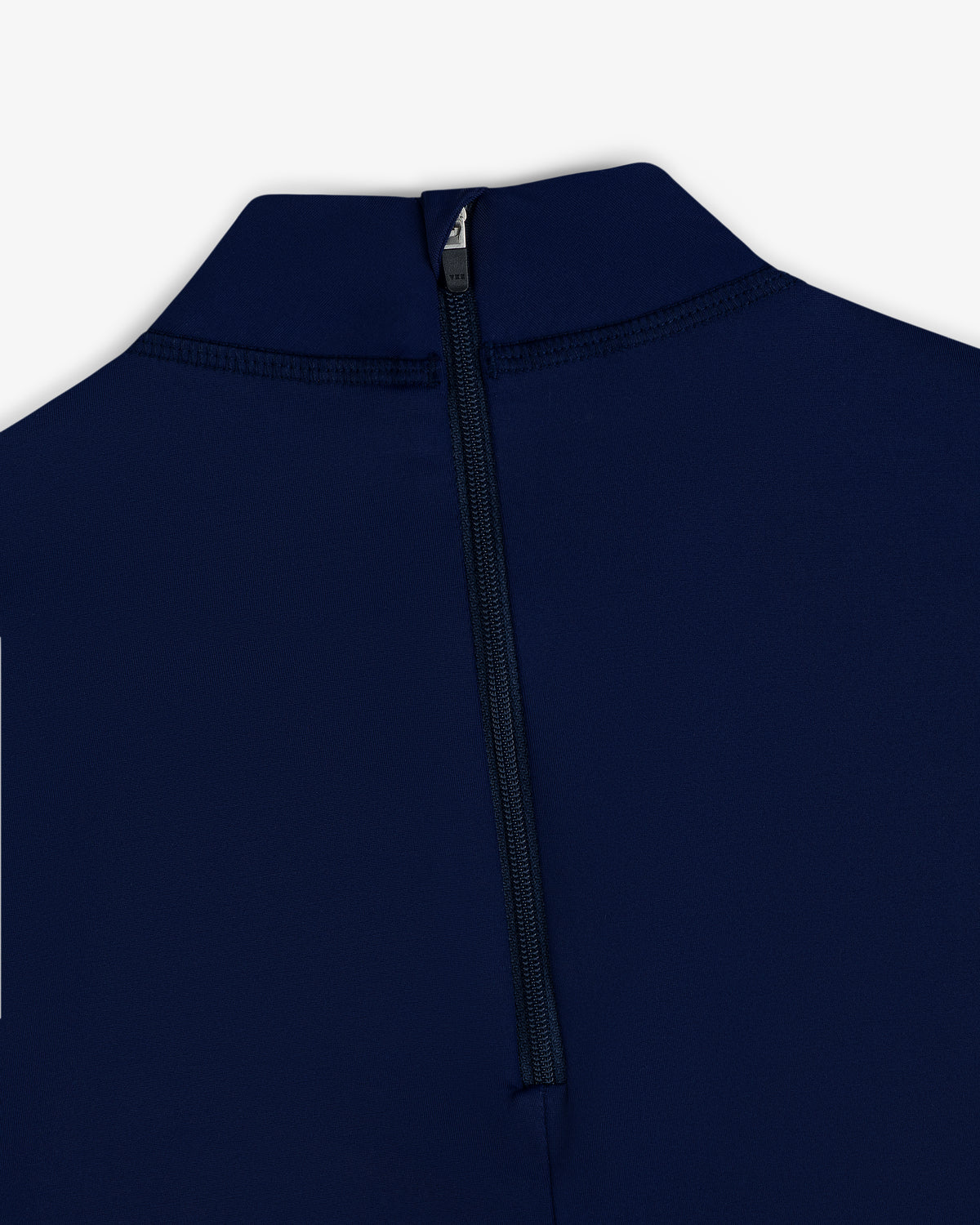 Close-up of the Short Sleeve Crest Rash Guard in navy blue, featuring a high collar and a black back zipper.