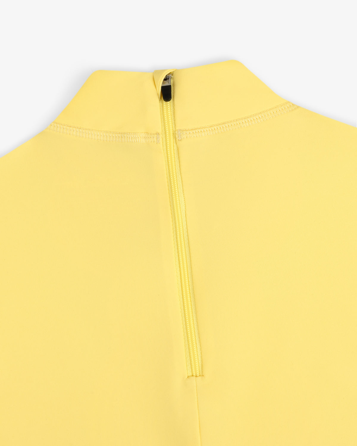 Close-up of the Short Sleeve Crest Rash Guard in yellow with a visible zipper at the back near the collar.