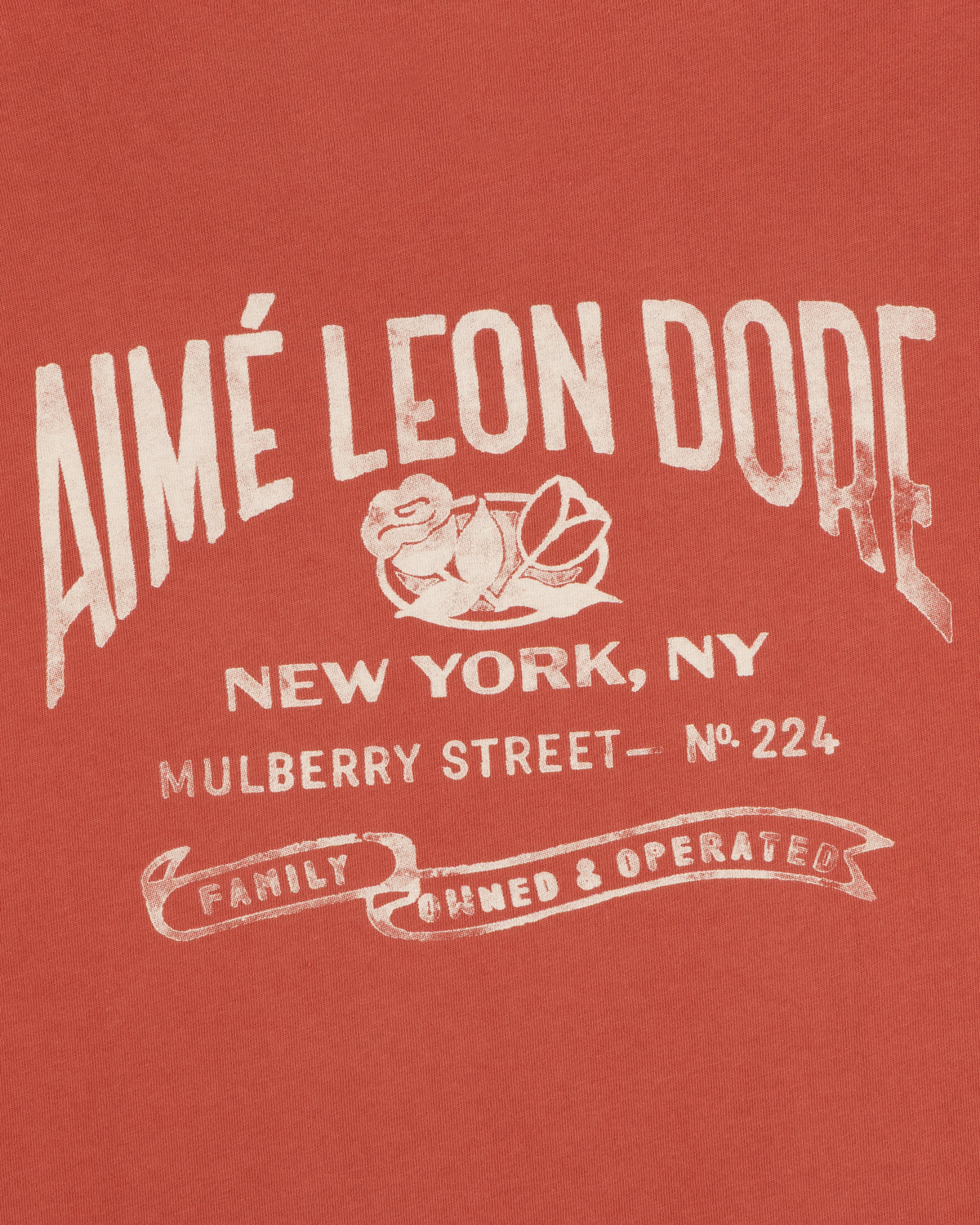 Red Neighborhood Pocket Tee with white text: Aimé Leon Dore, New York, Mulberry Street No. 224, Family Owned & Operated.