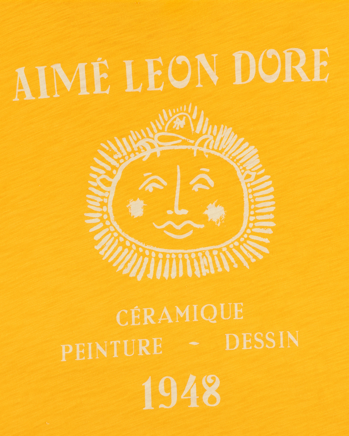 Yellow background, white Aimé Leon Dore text, sun face, Céramique Peinture Dessin 1948 on Artiste Pocket Tee.