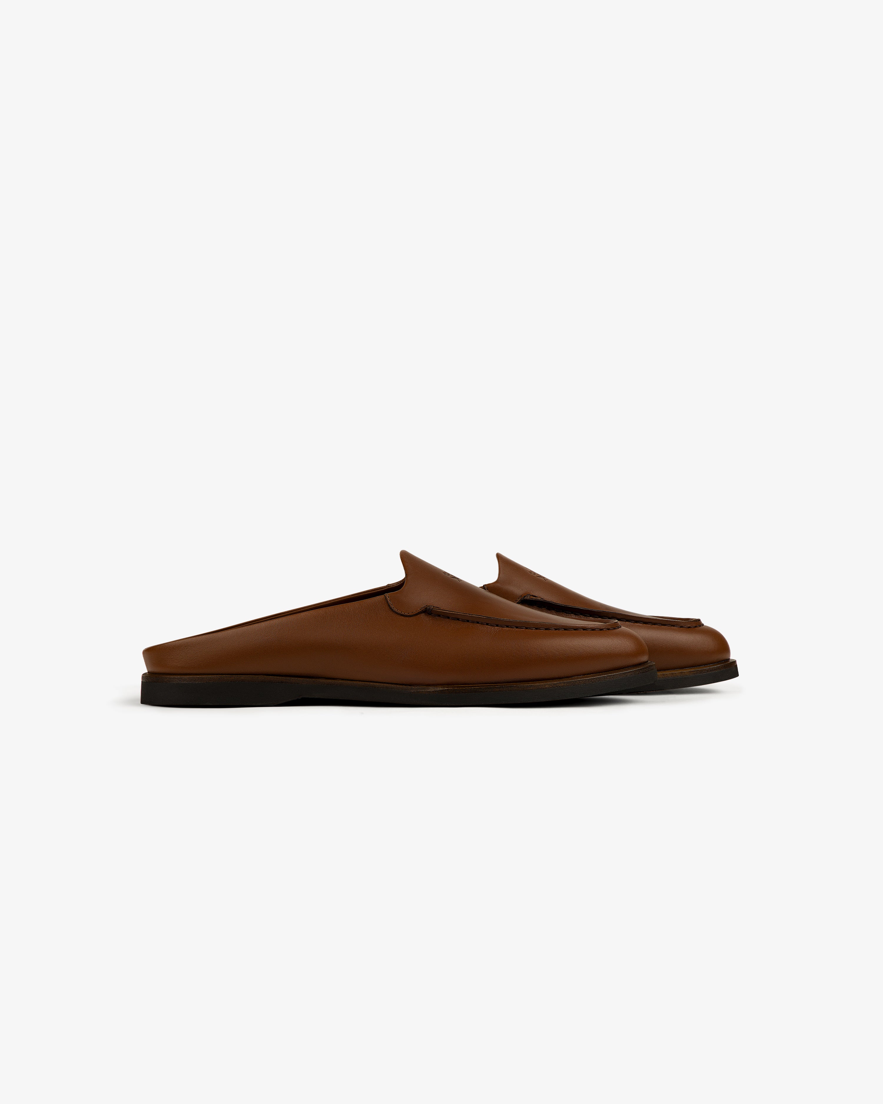 Venetian Mule brown leather slip-on loafers with black soles, side view on a white background.