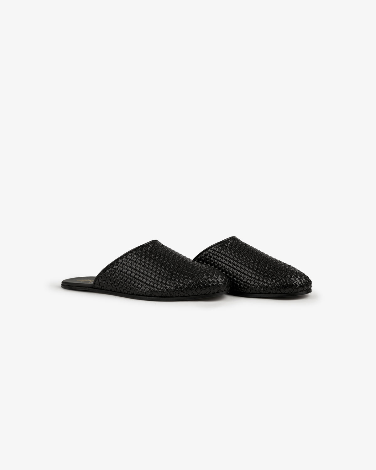 A pair of Leather Raffia Mules in black with closed toes displayed on a plain white background.