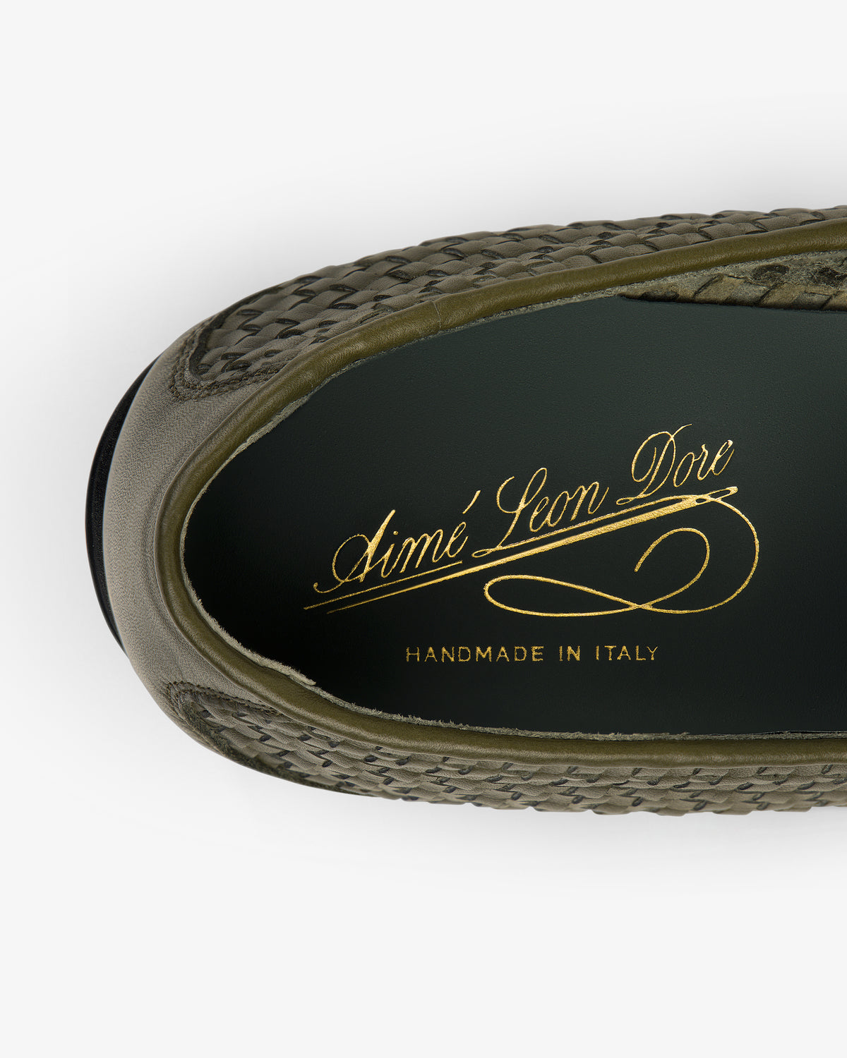 Top view of the Leather Raffia Loafer in green with gold Aimé Leon Dore Handmade in Italy text on the insole.