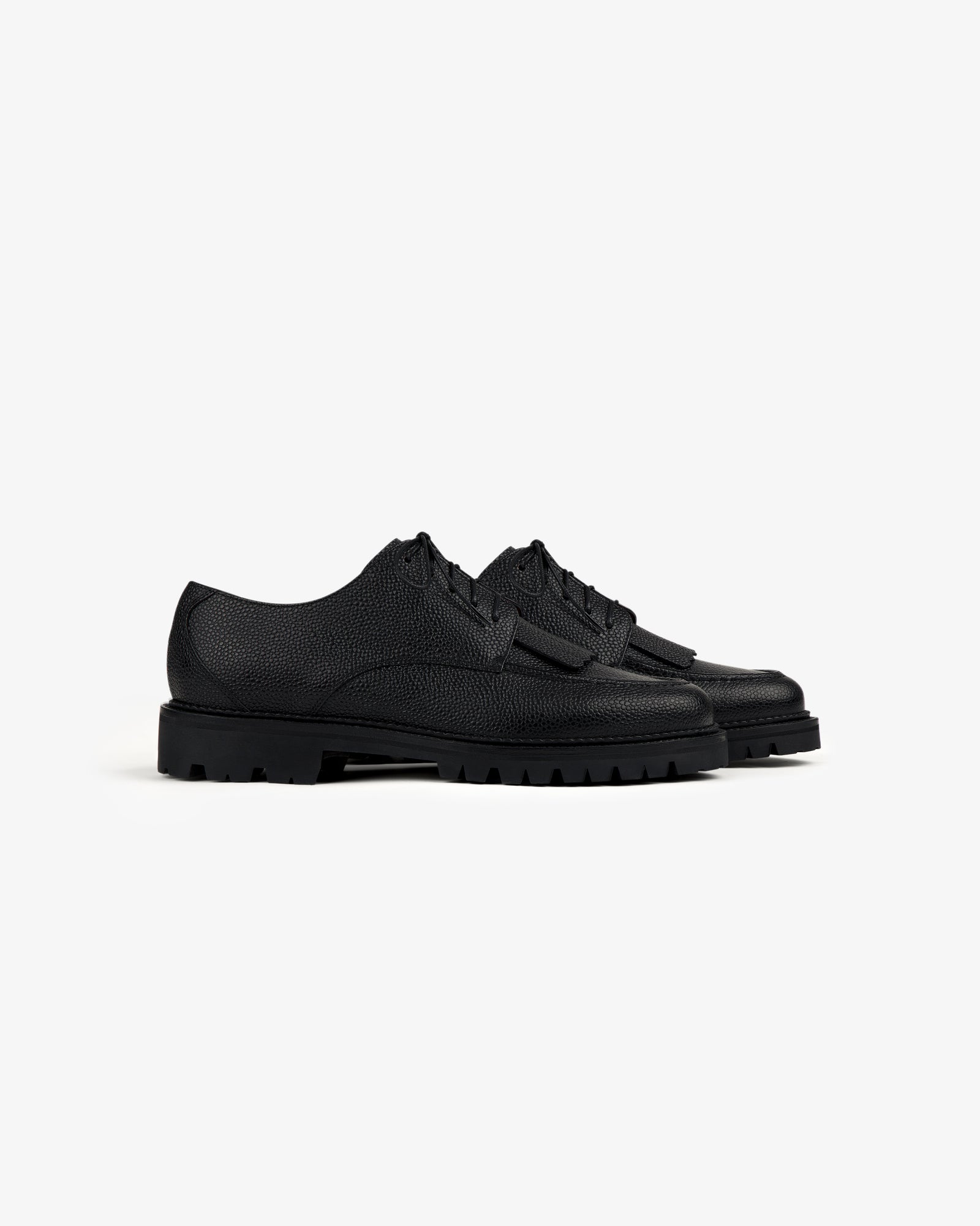 Leather Lug Sole Derby shoes in black leather with chunky rubber soles, shown on a plain white background.