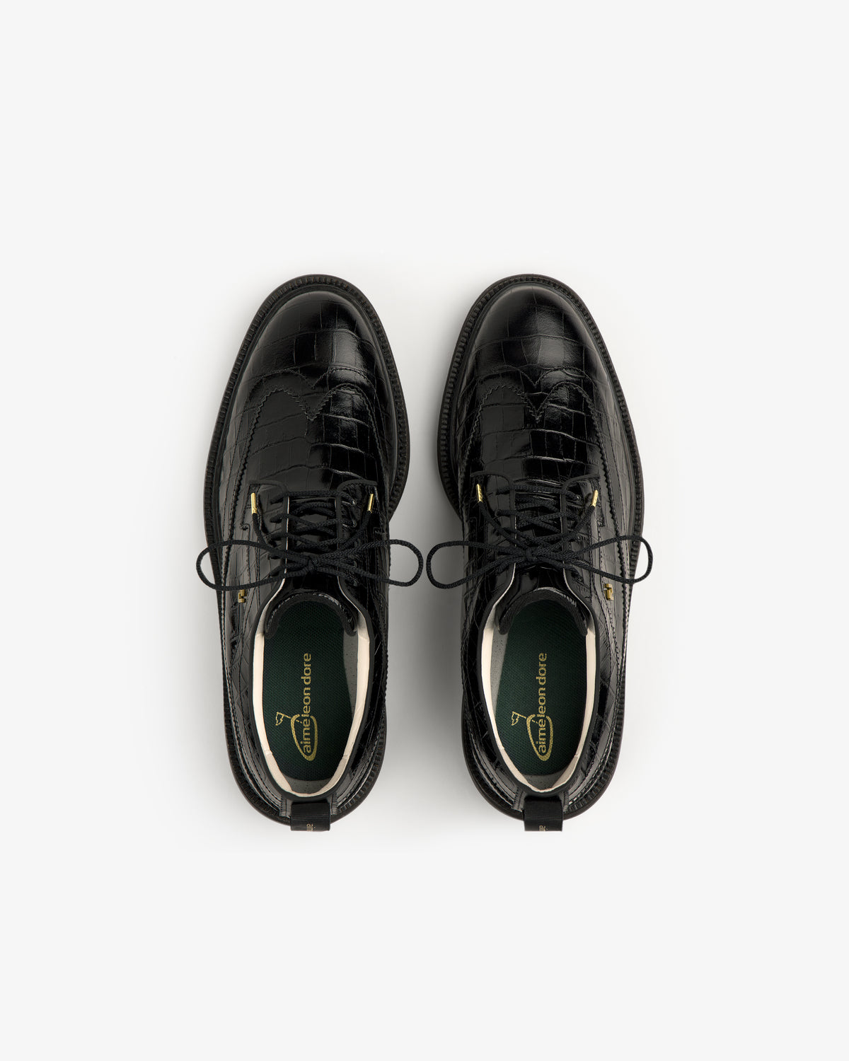 ALD / Footjoy Croc-Embossed Premiere Series Marquis black lace-up shoes, top view on a white background.
